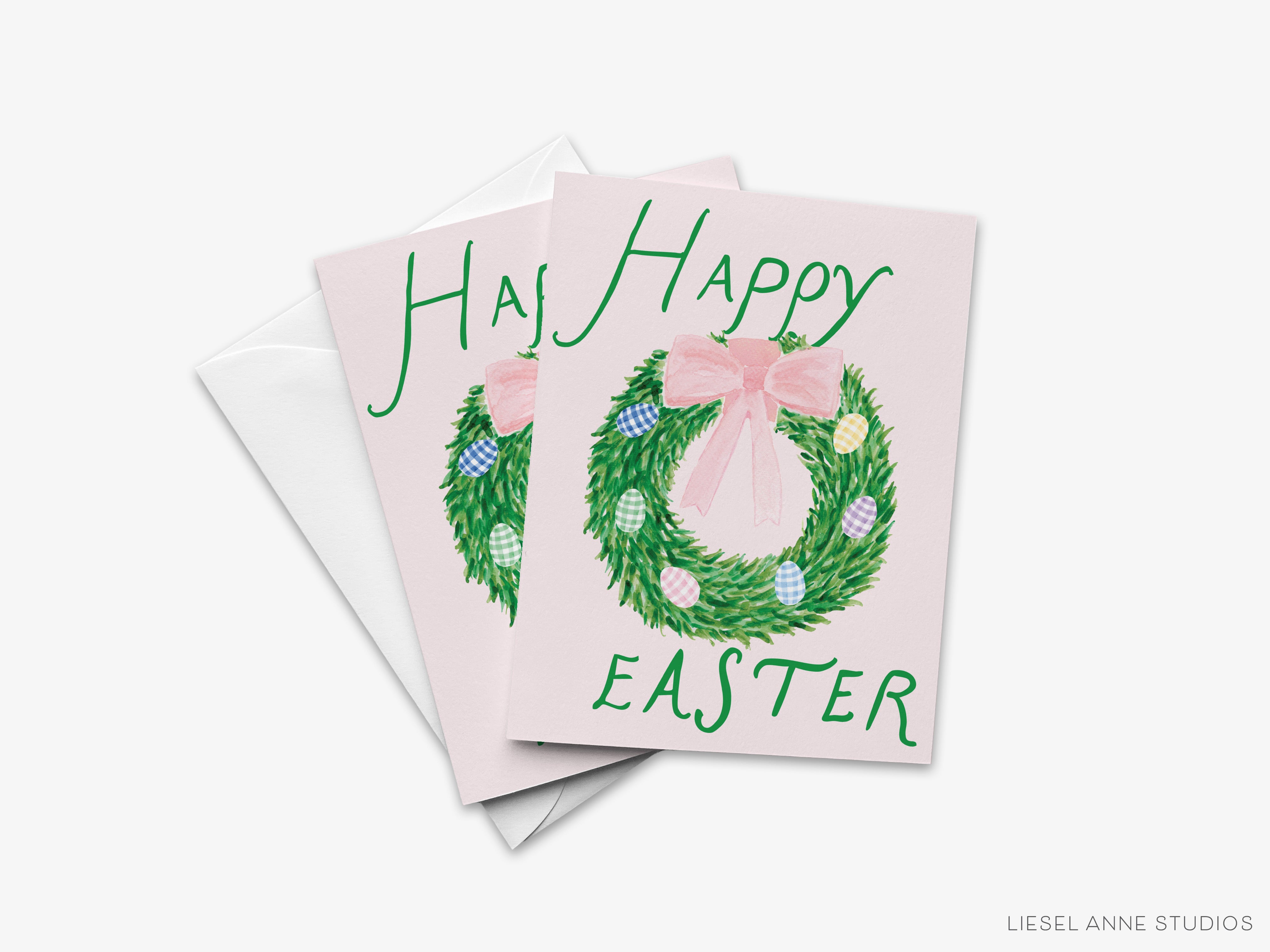 A pink Easter greeting card with a wreath and the text "Happy Easter" printed on it.