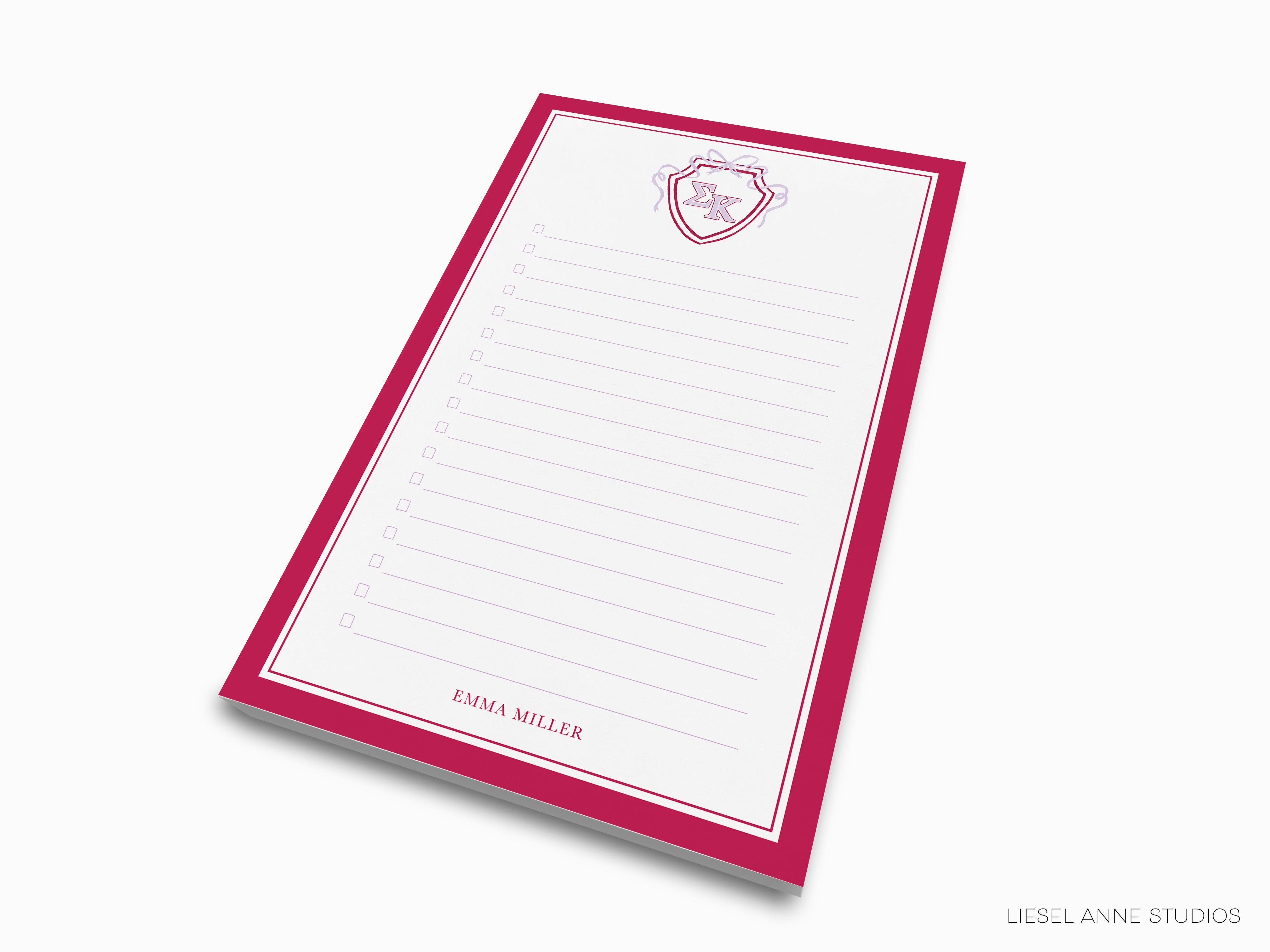 a red and white notepad with a heart on it