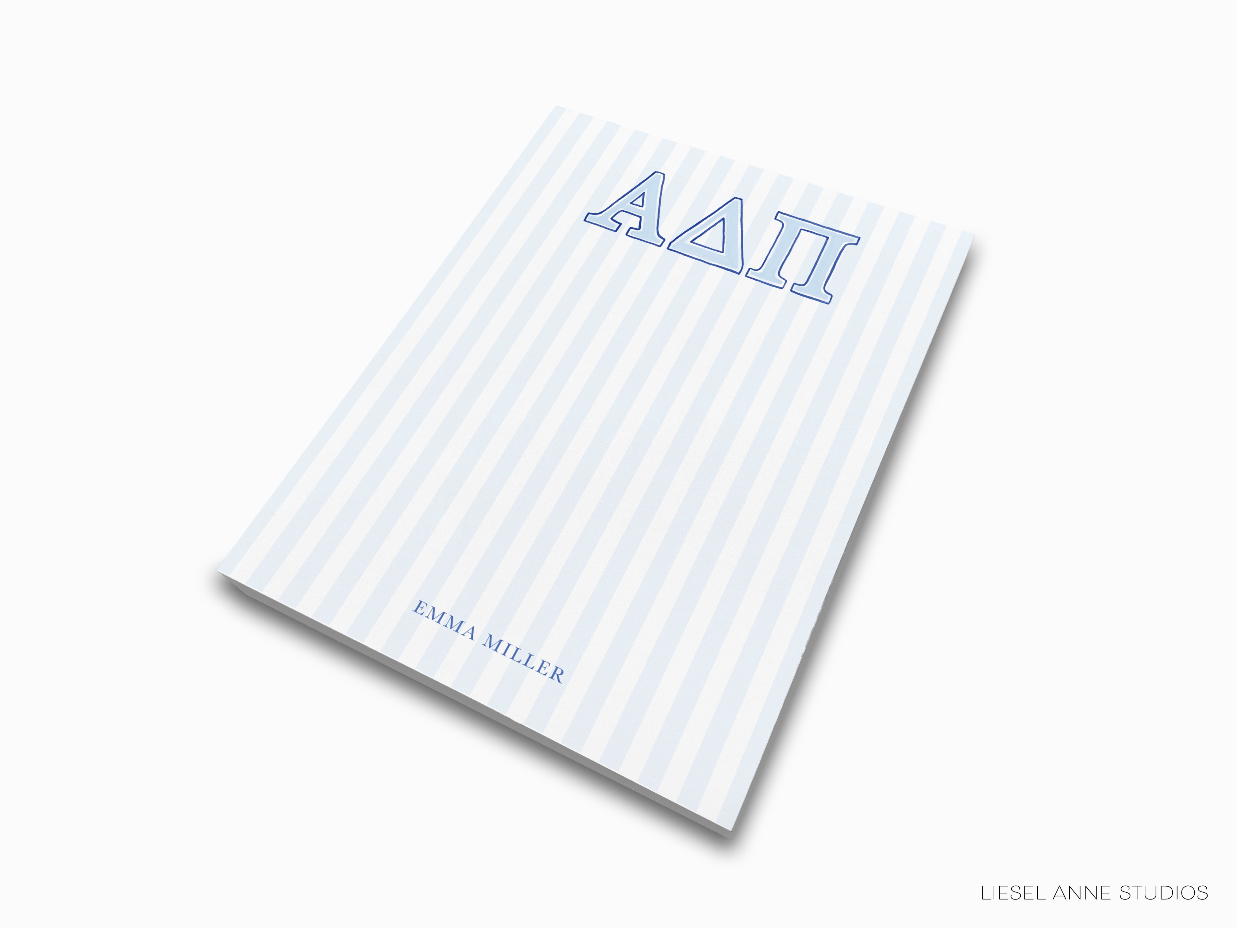 a blue and white striped notebook with the word aati on it