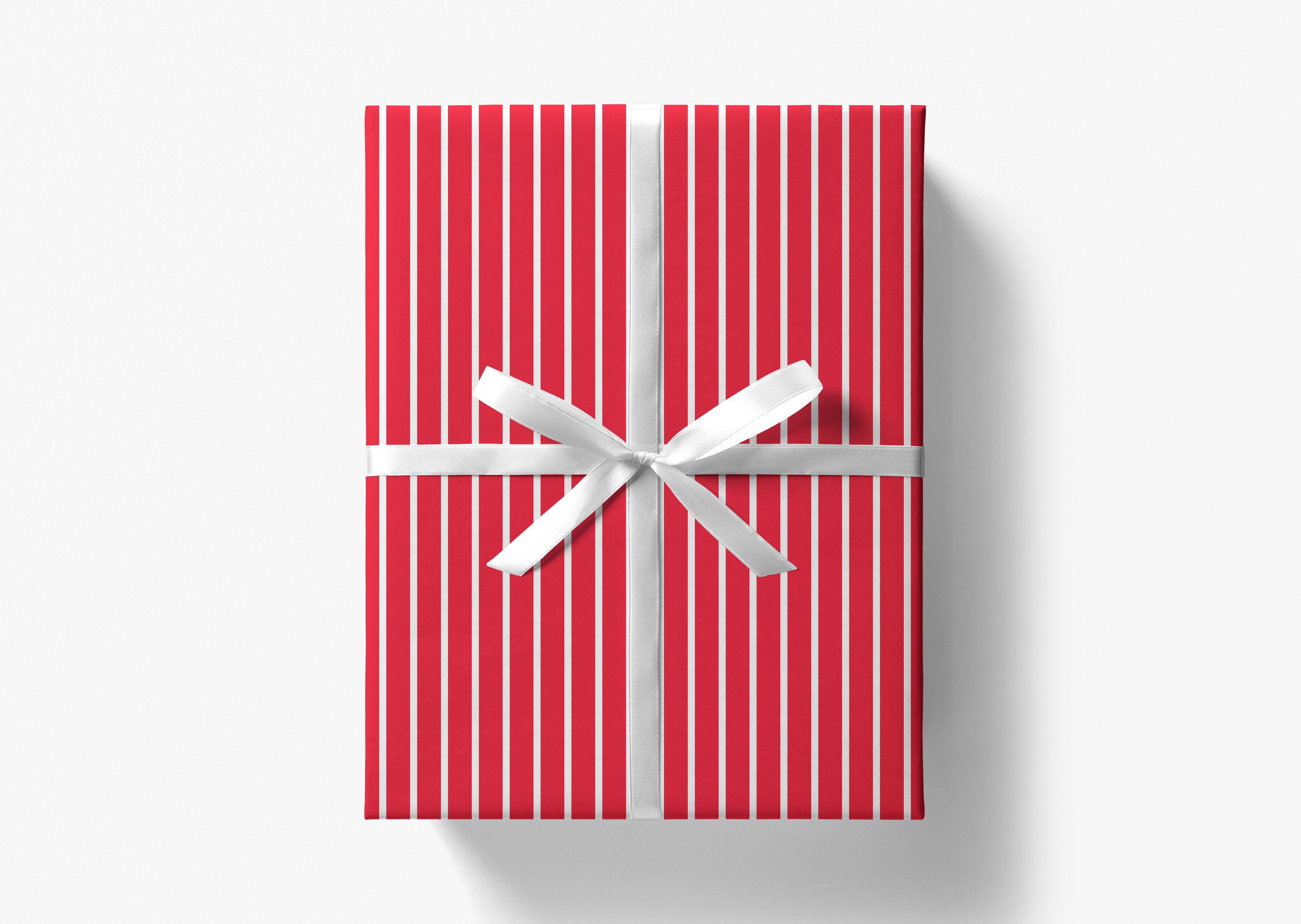 A red gift box with a white ribbon tied in a bow, placed against a white background.
