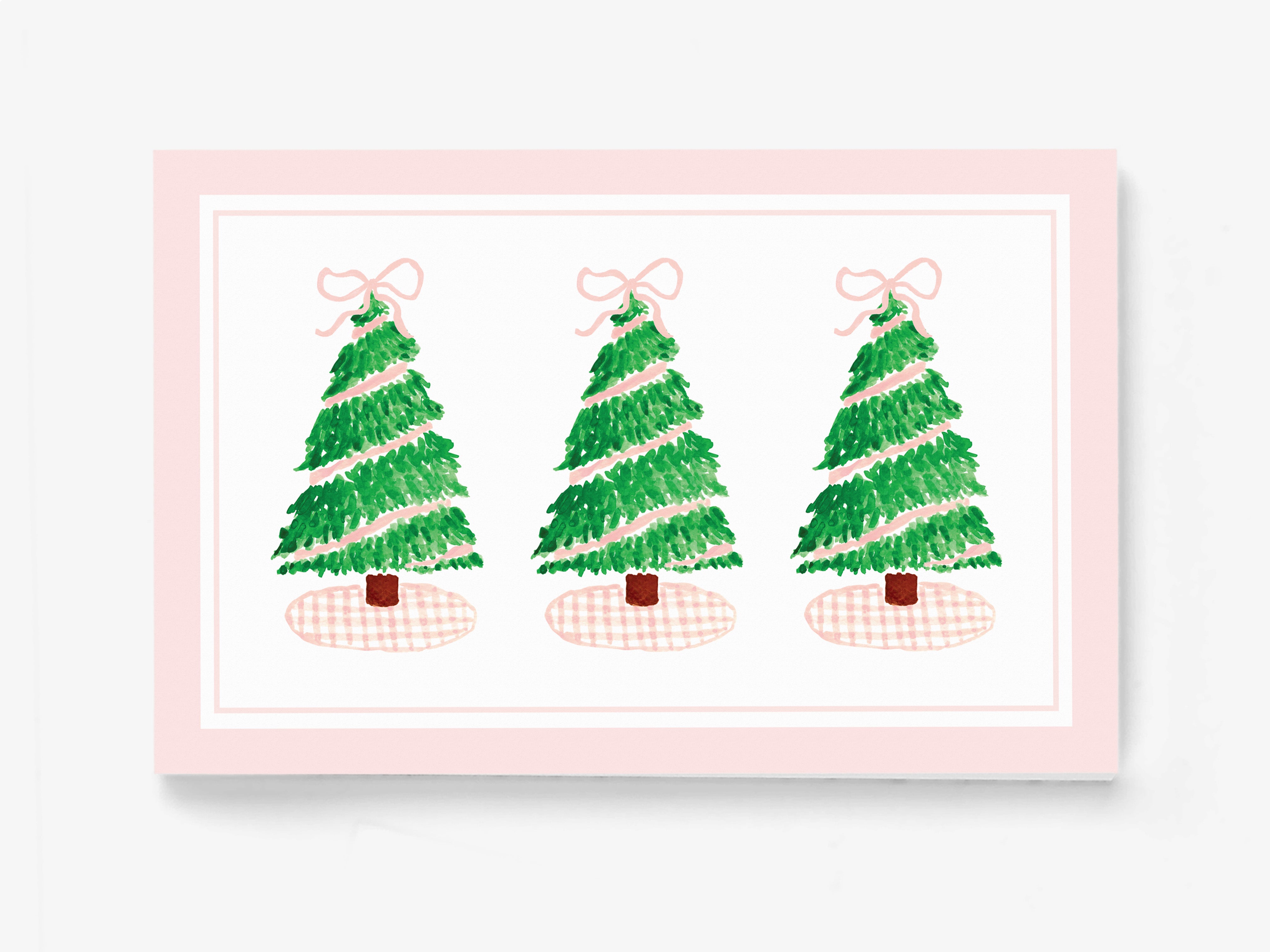 A pink-framed illustration of three Christmas trees with bows on top, arranged in a row.