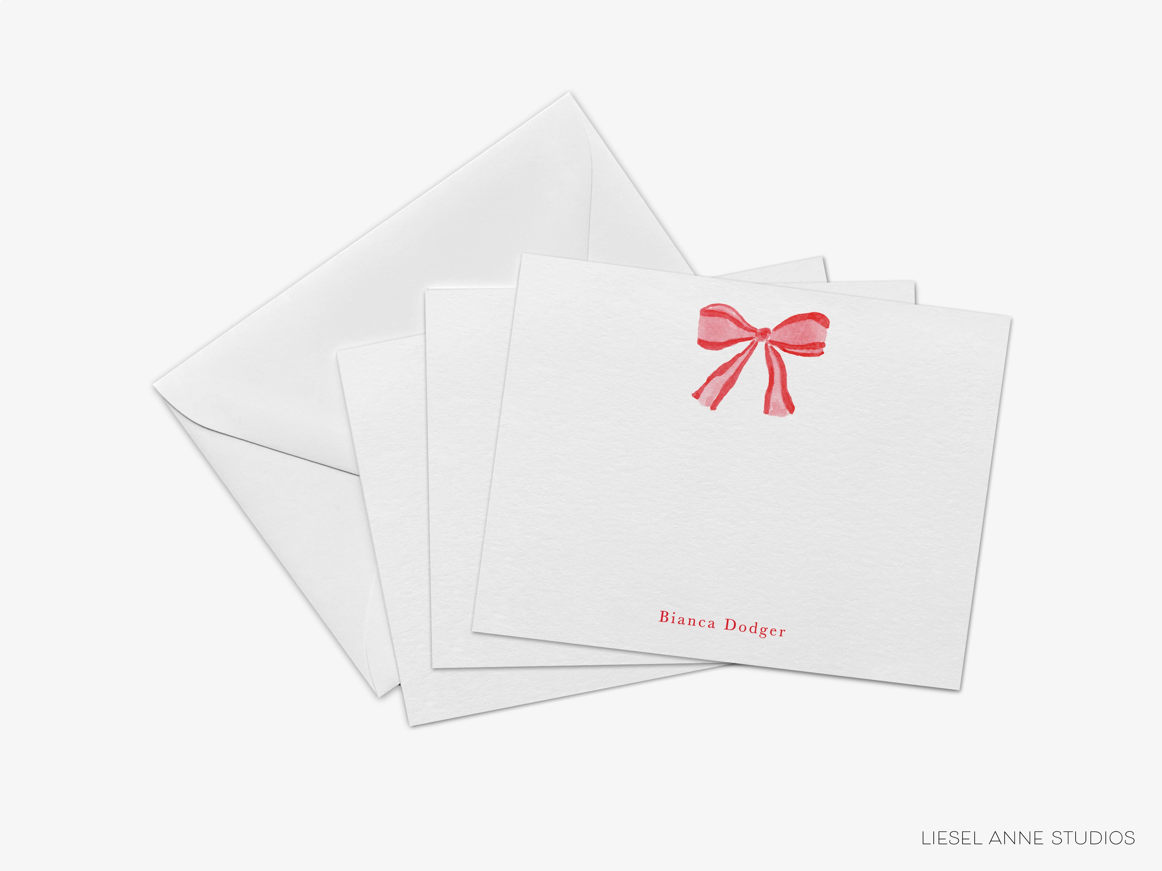 a set of white envelopes with a red bow on them, arranged on a white background.
