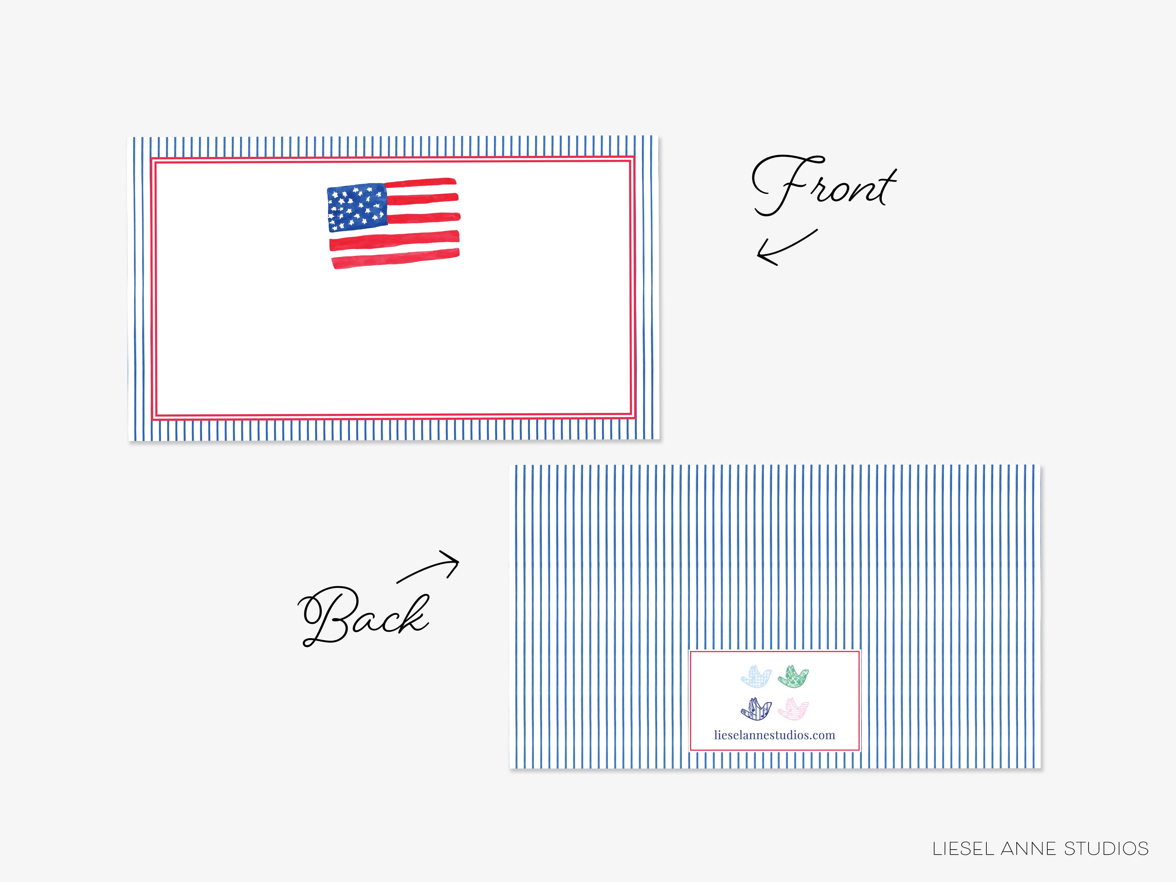 a white card with a blue striped border, featuring an American flag on the front and a small label on the back.