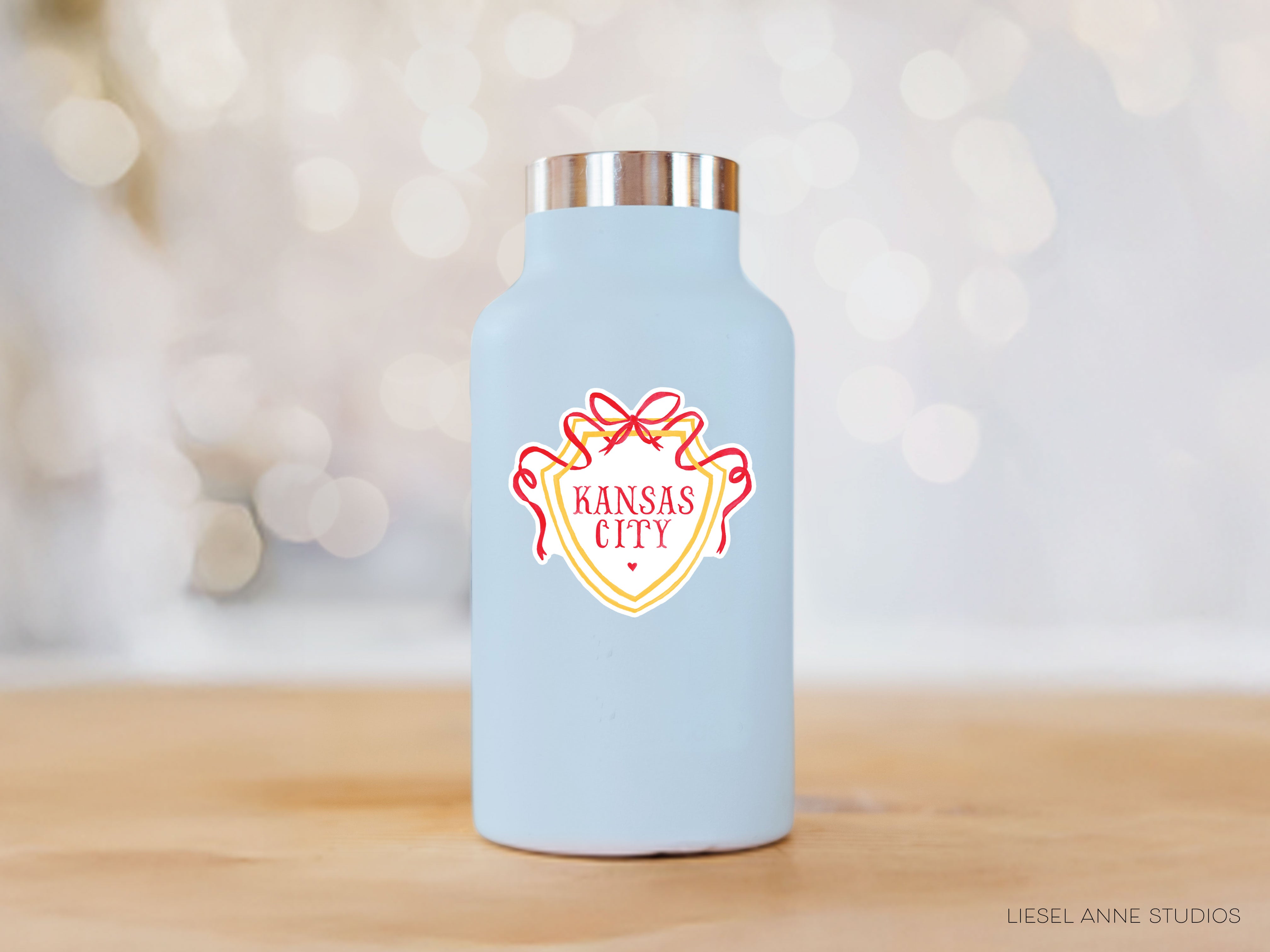 a blue water bottle with a red and yellow logo on it
