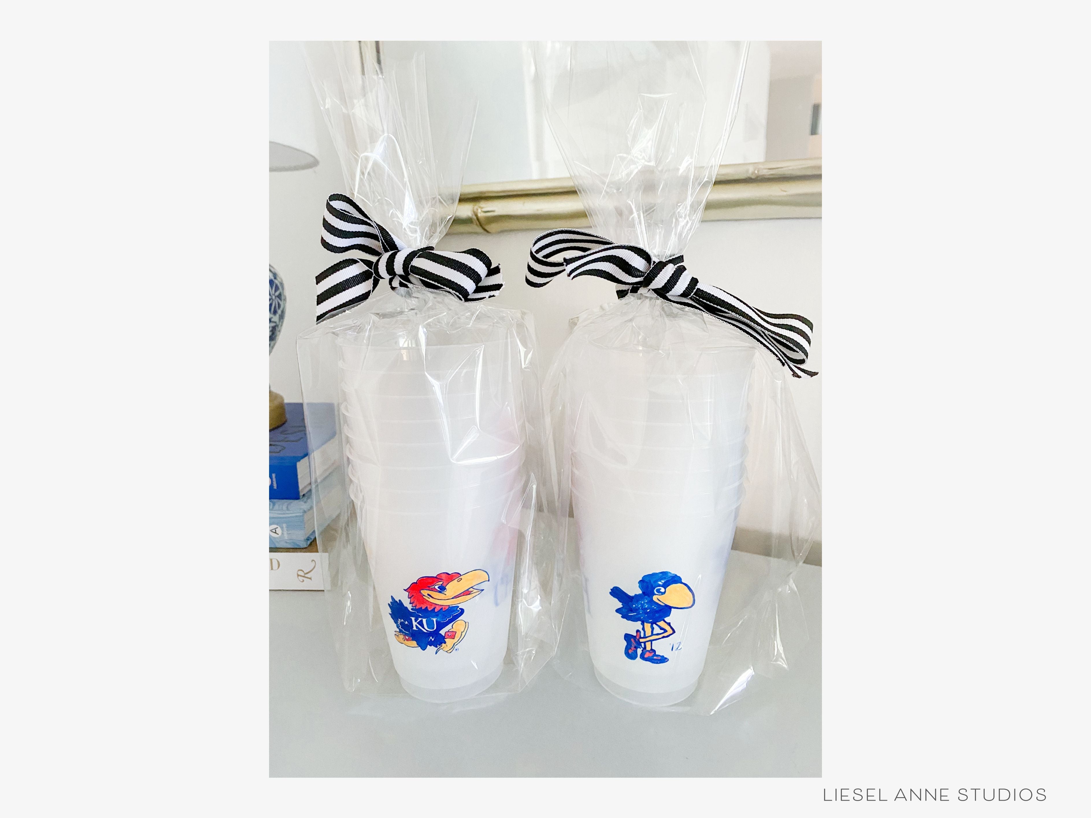 1912 Jayhawk *Officially Licensed* RCJH 16oz Shatterproof Cups (Set of 8)-These officially licensed Kansas Jayhawk shatterproof cups feature our hand-painted 1912 Jayhawk and make great party decorations for watch parties, graduation, game days and more! They come in sets of 8 and are re-usable for other parties to come or make wonderful party favors!-The Singing Little Bird