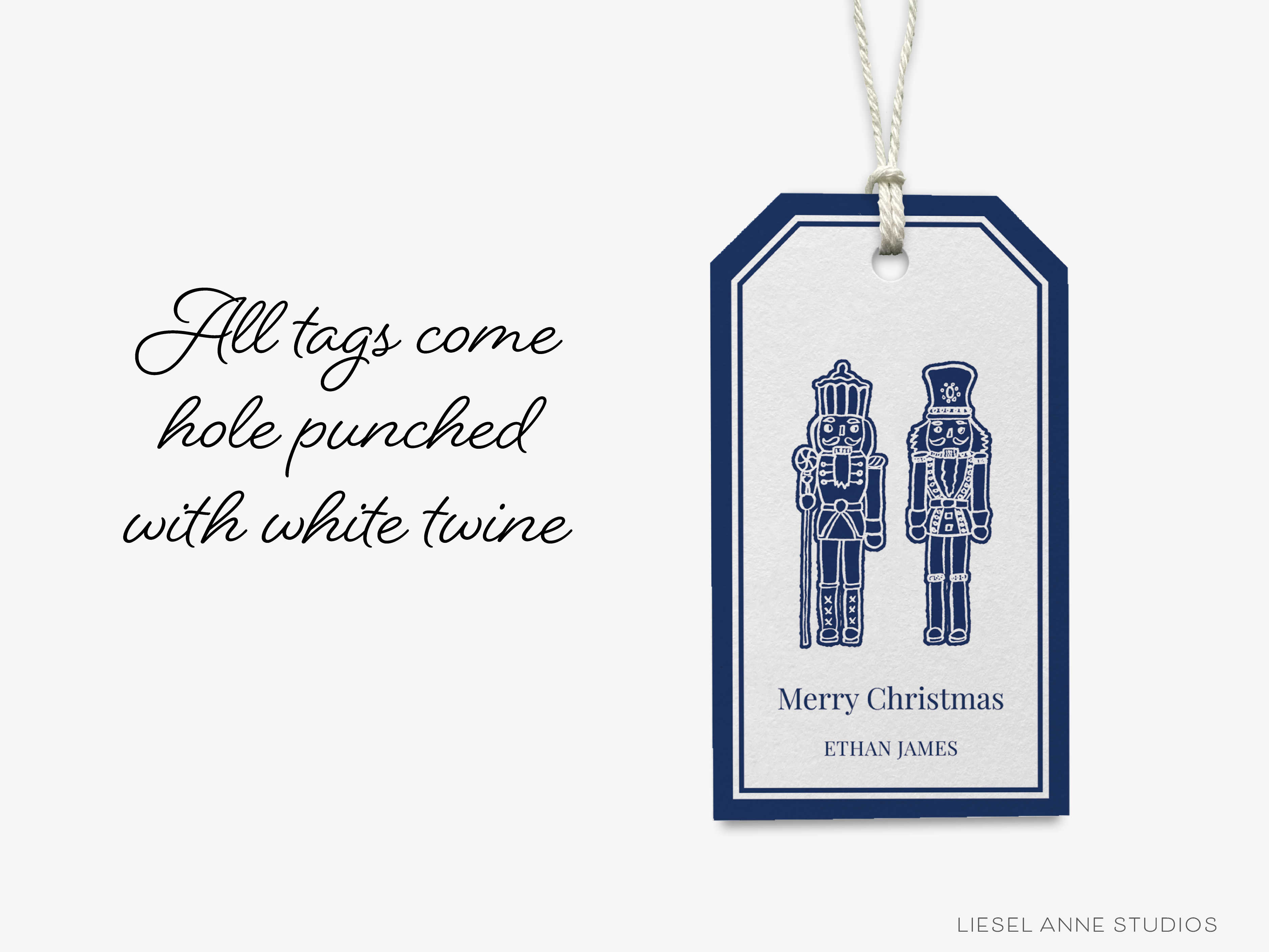 A blue and white tag with a nutcracker and a message that reads "Merry Christmas Ethan James" hangs on a string.