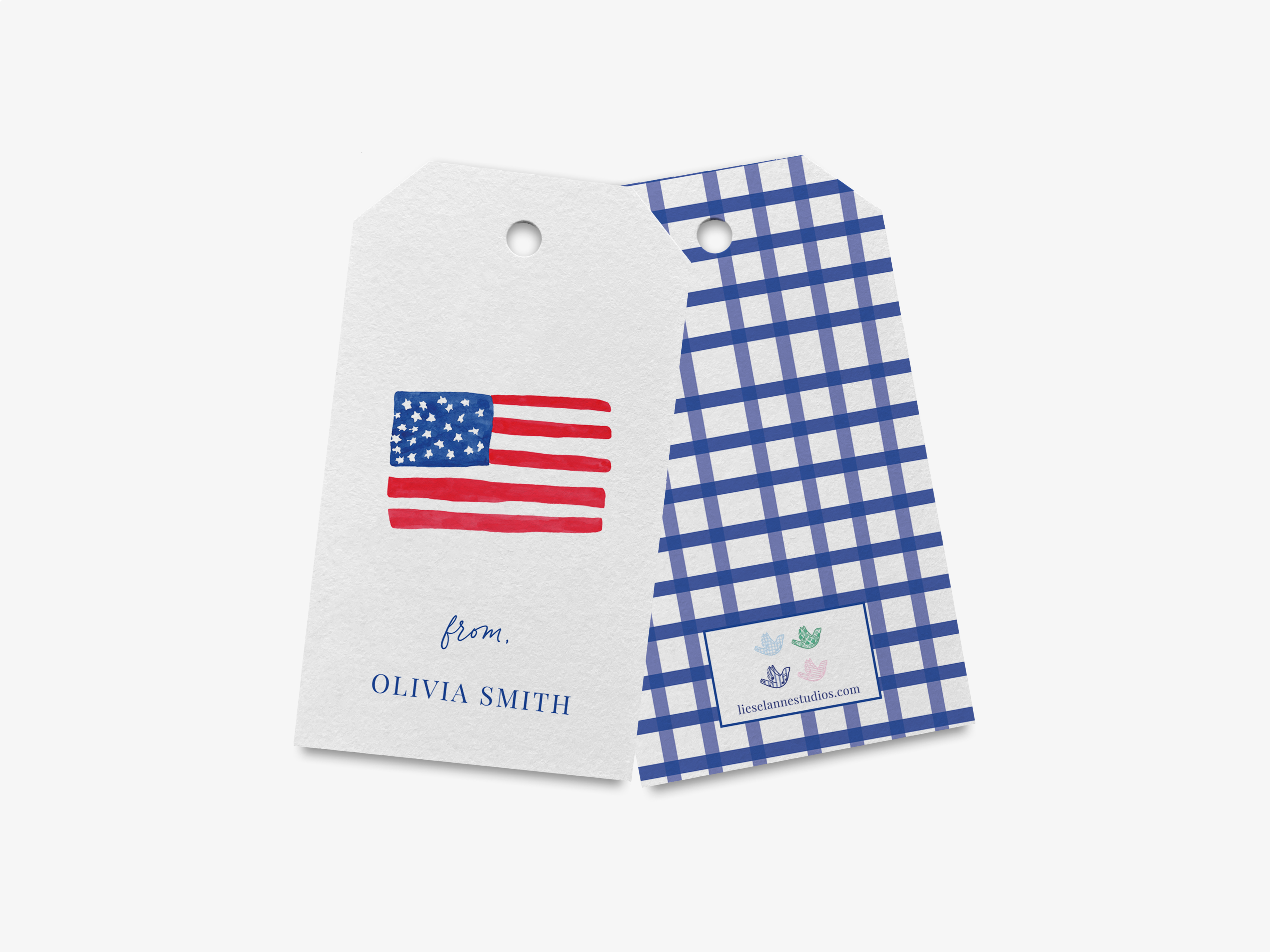a white tag with a blue and white checkered pattern and an American flag design, along with a name tag below it.
