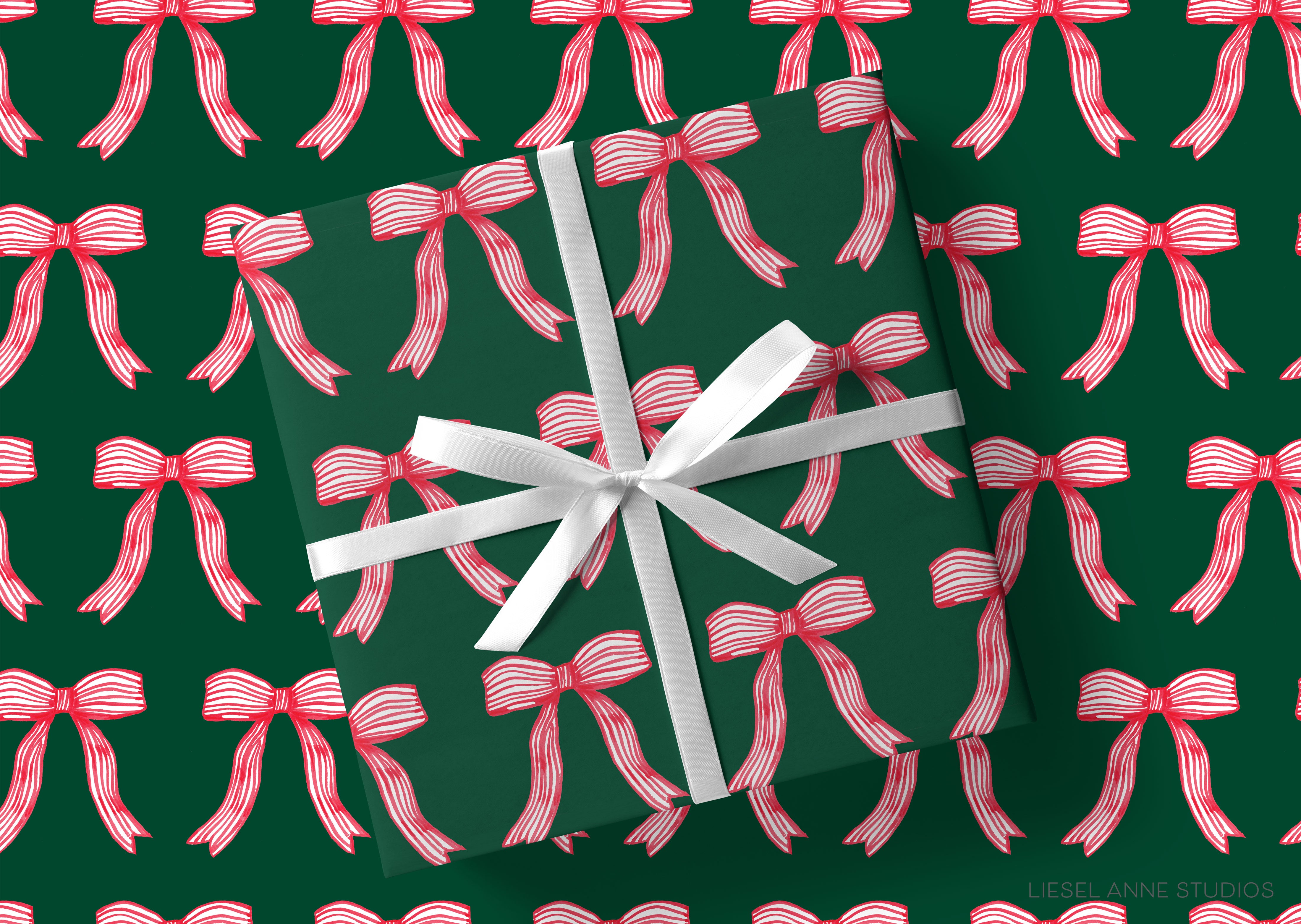 a pattern of red and white bows on a dark green background.