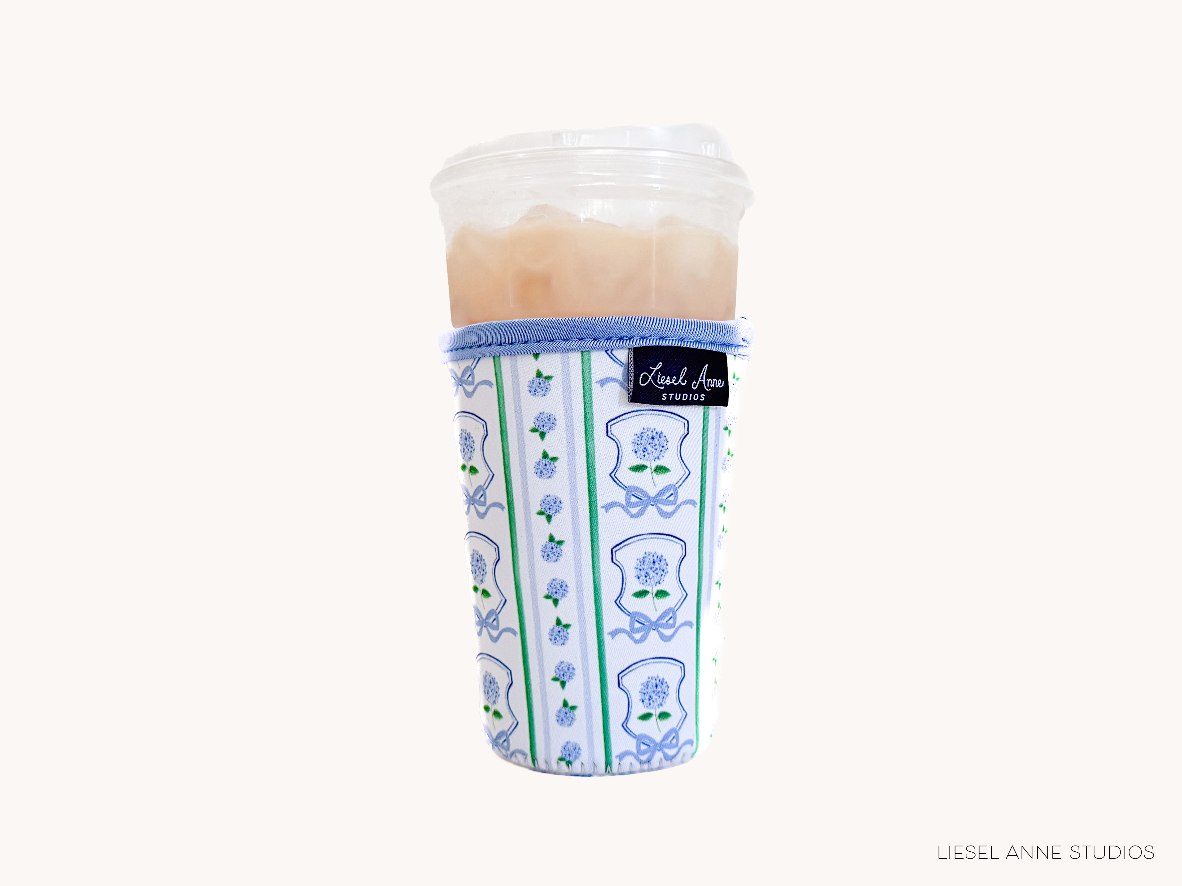 A cup with a printed pattern on it, placed against a white background.