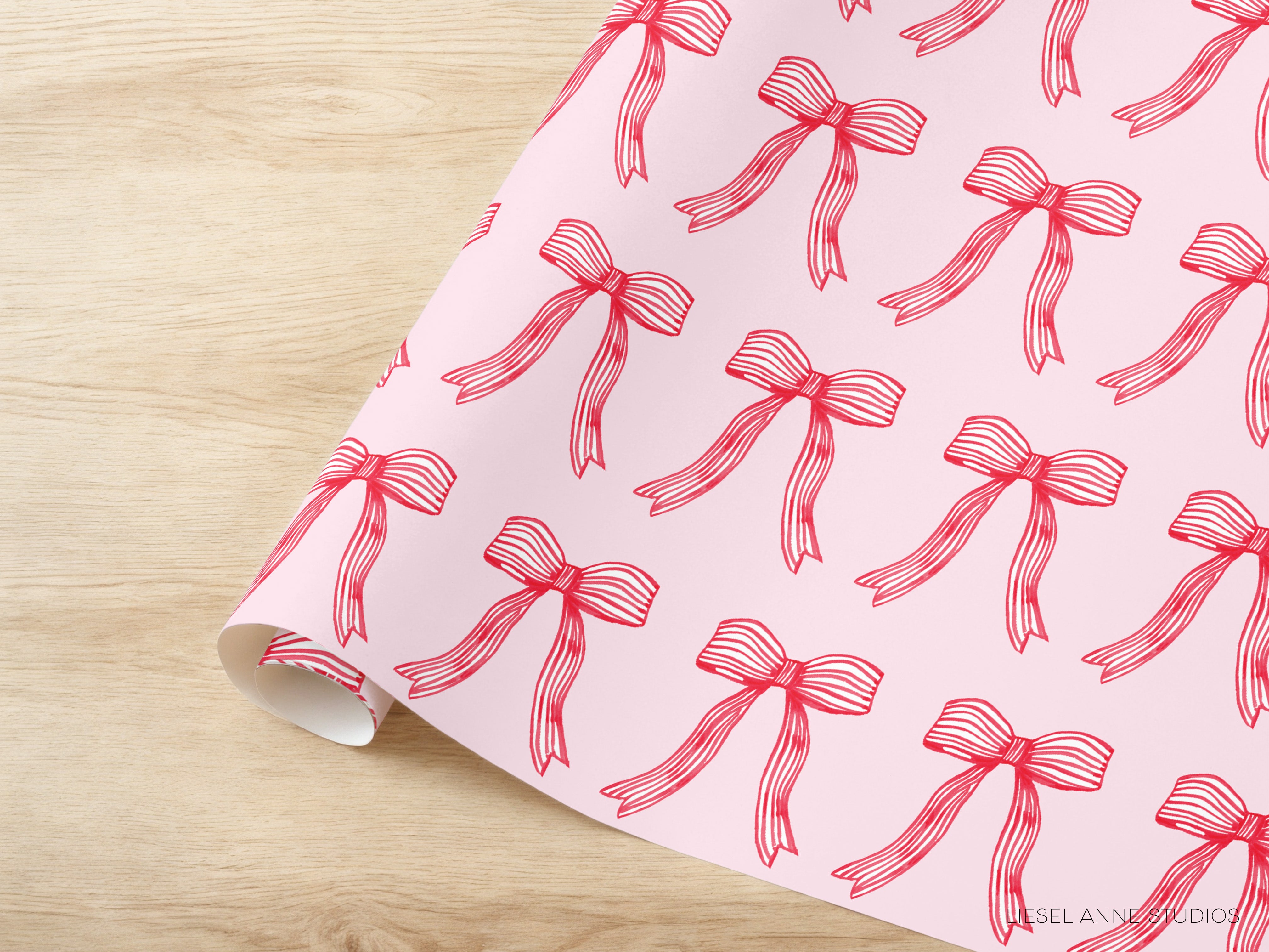 a pink background with a repeating pattern of red bows on it.