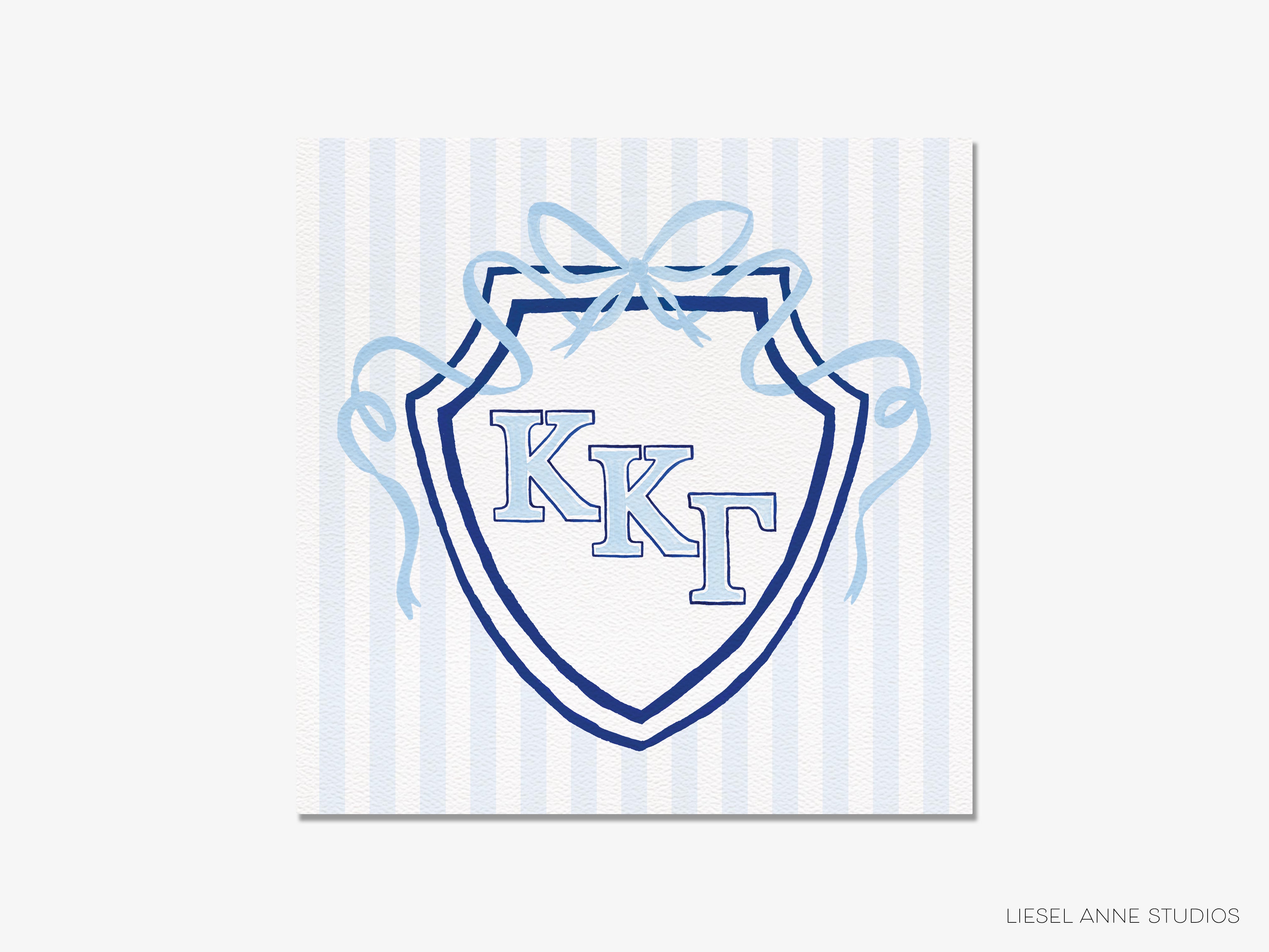 A shield-shaped logo with the letters 'KKT' in the center, surrounded by blue ribbons.