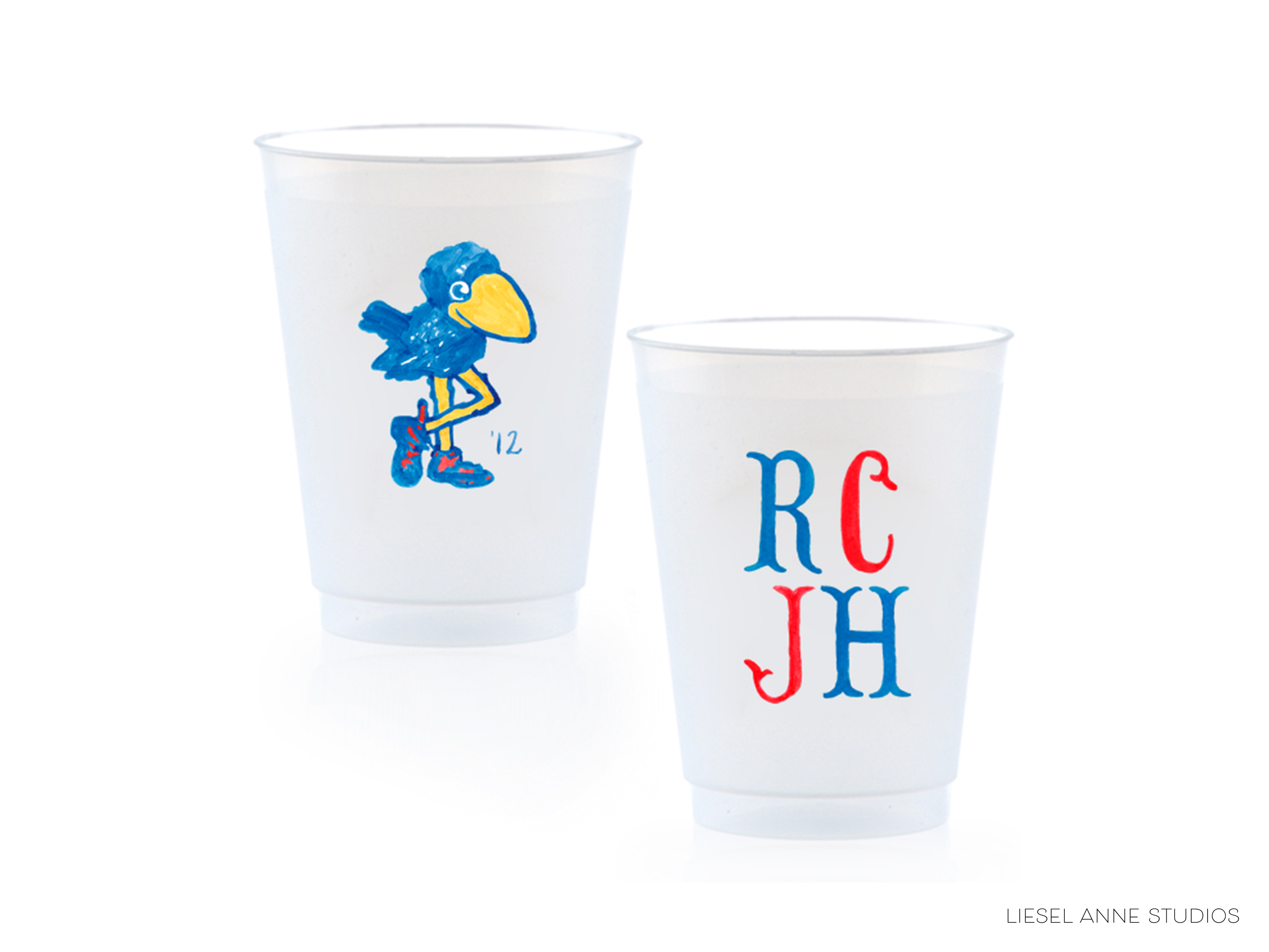 Two white plastic cups with different designs on them.