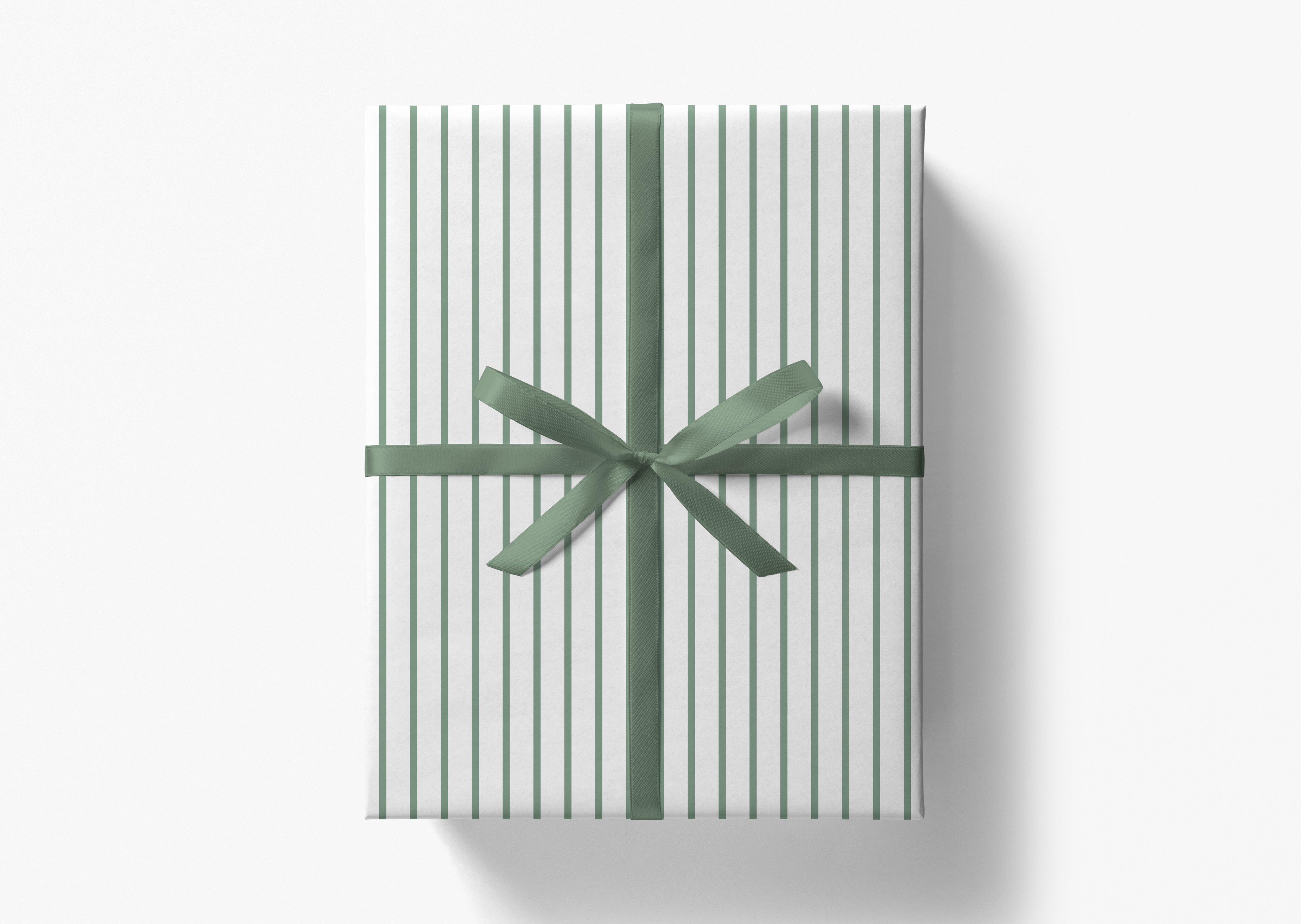 A gift box wrapped in a striped green and white paper, tied with a green ribbon bow.