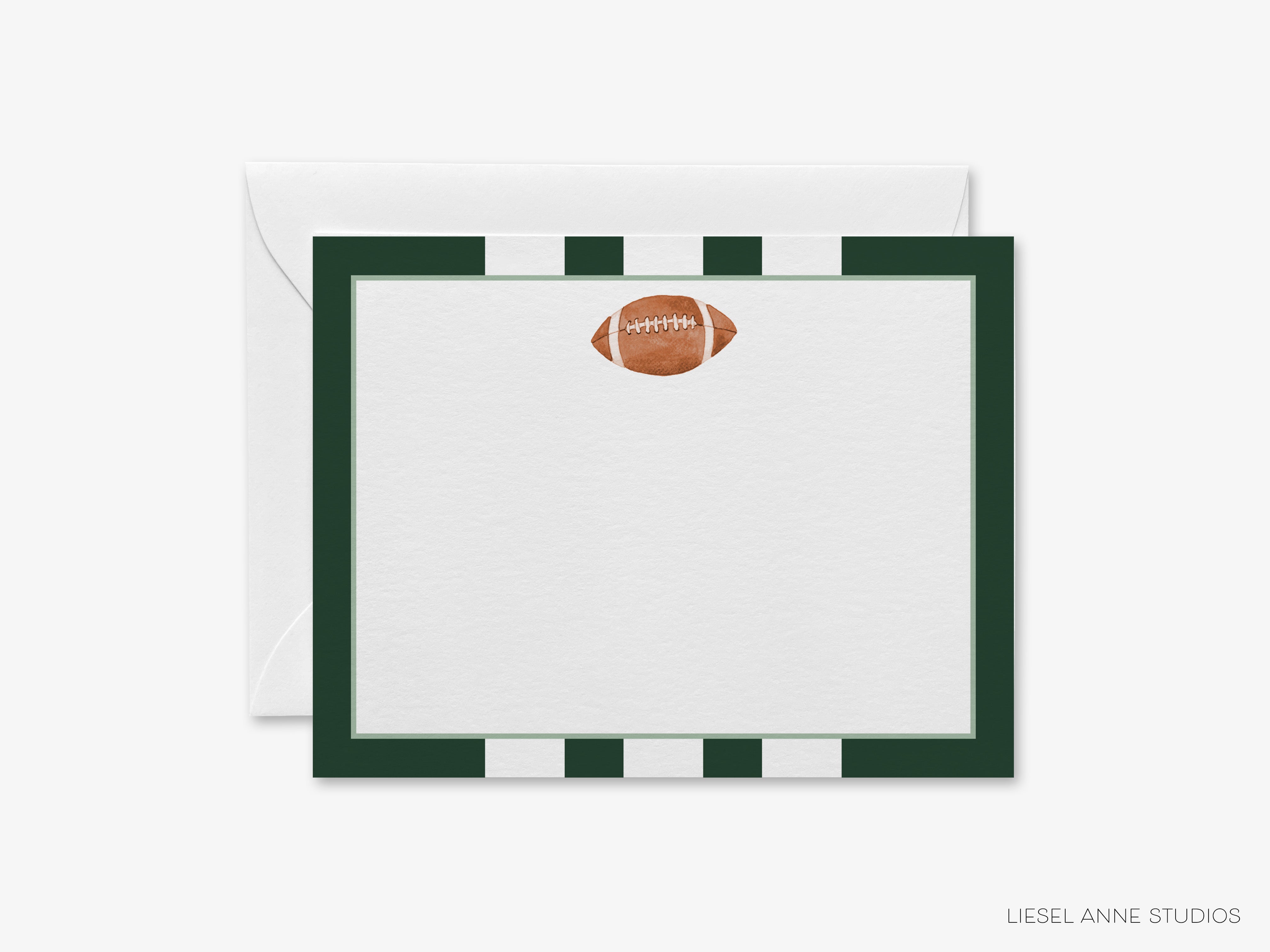 A white card with a green border and a football graphic on it, placed on top of an envelope.