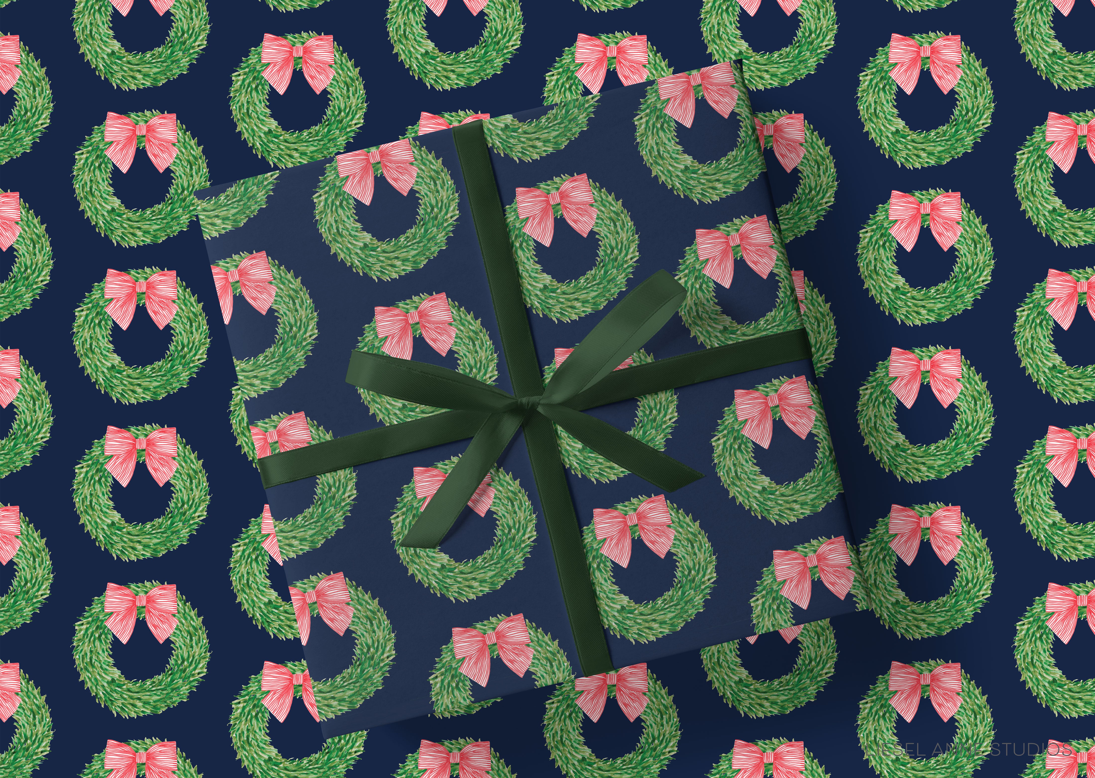 a pattern of green wreaths with pink bows on a dark blue background.