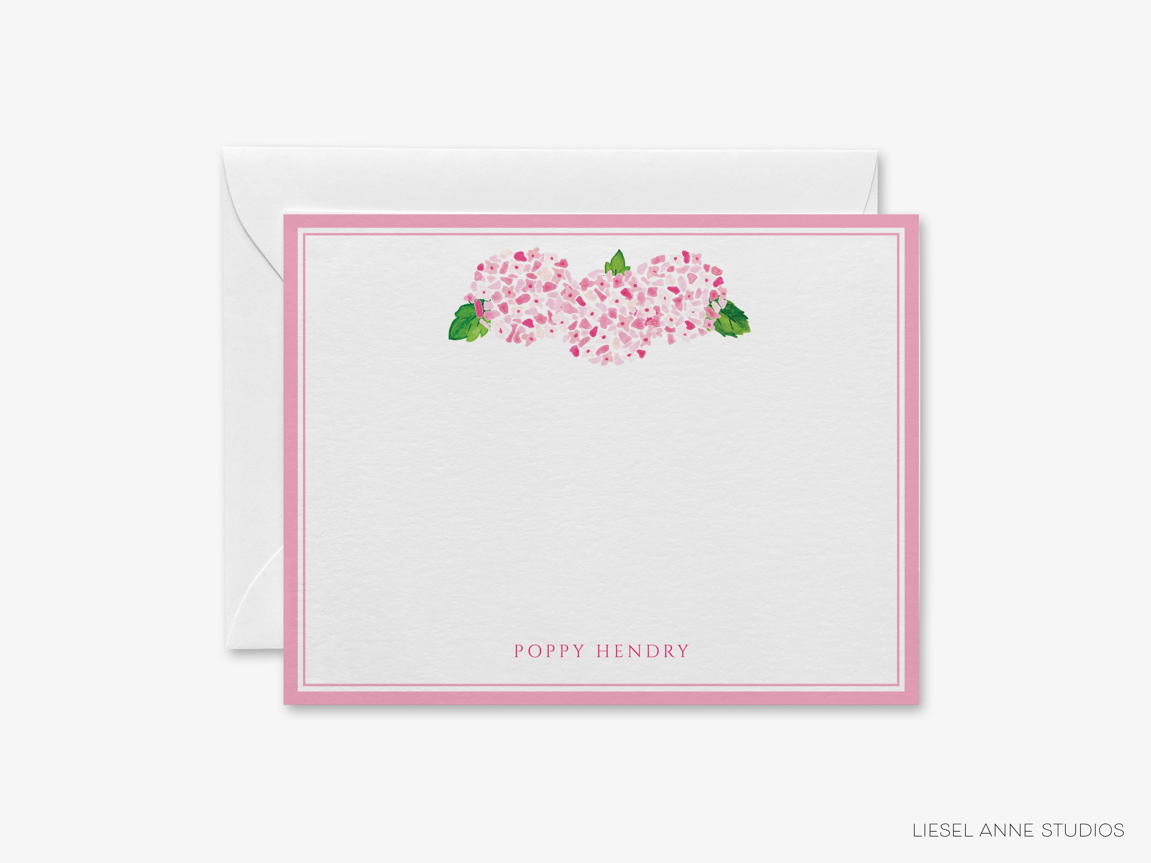 a white card with pink flowers on it