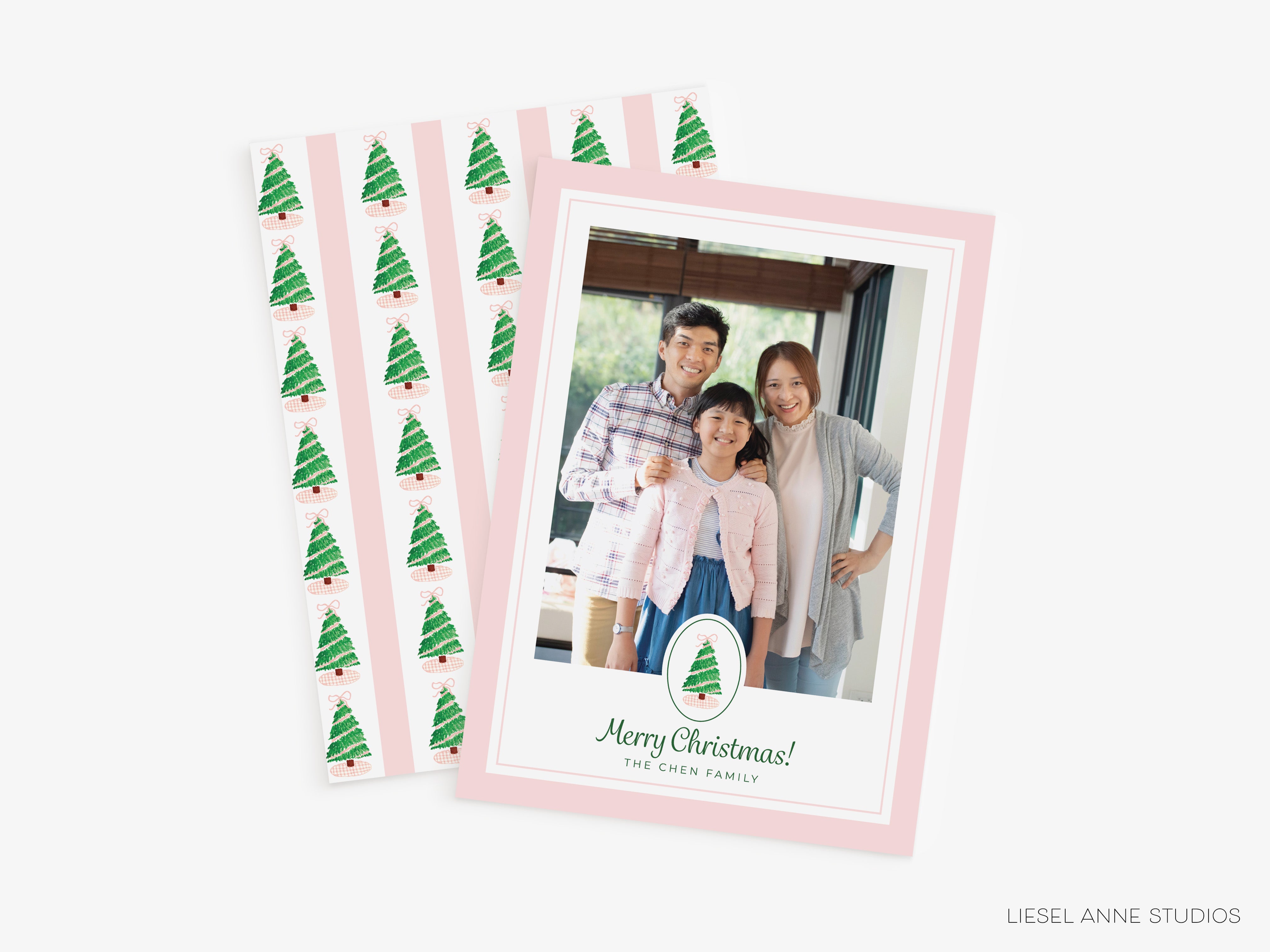 A family photo of a man, woman, and child, along with a Christmas tree pattern and the text "Merry Christmas! The family" on a pink background.