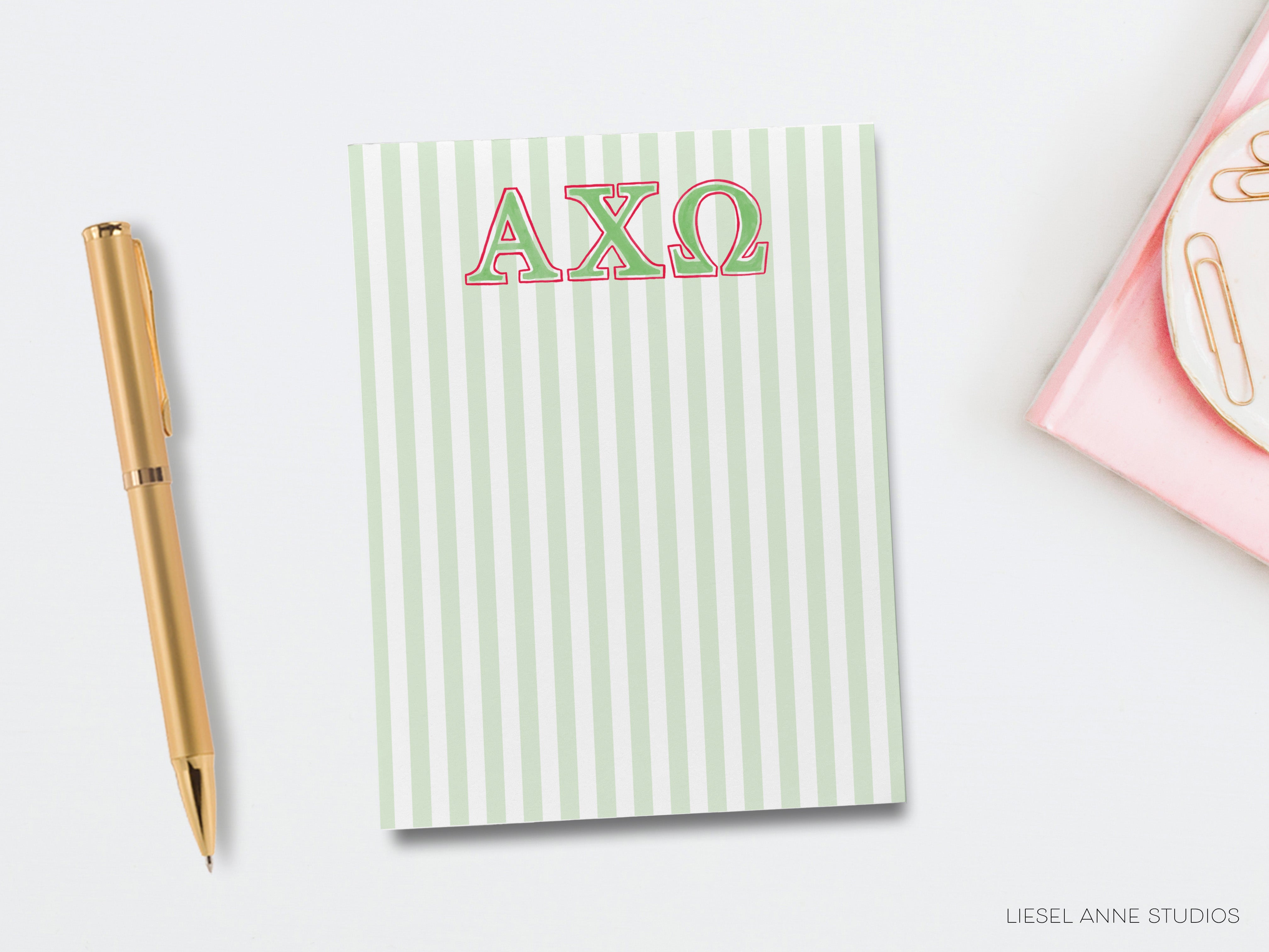 a notepad with the word axo on it next to a pen