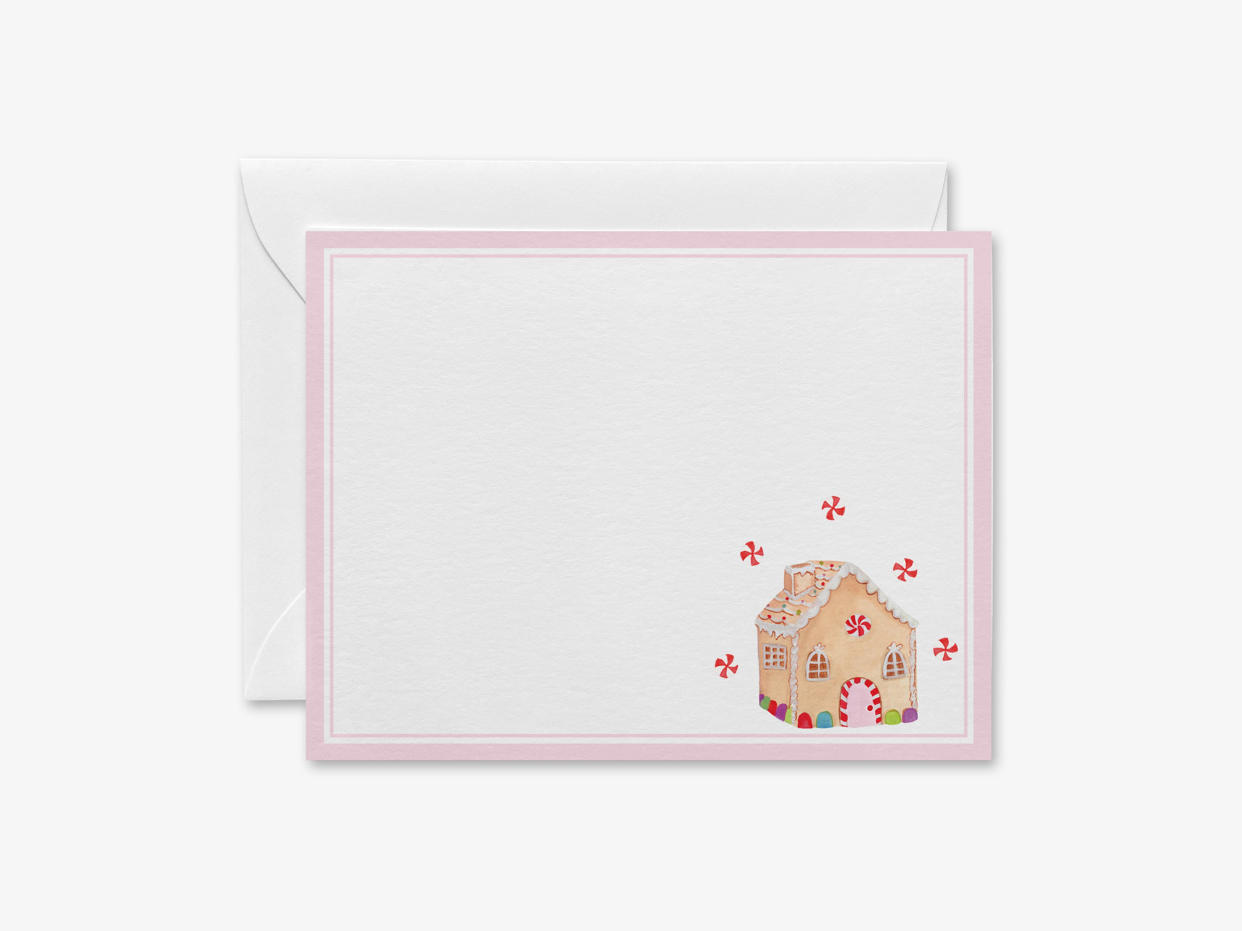 a card with a gingerbread house on it