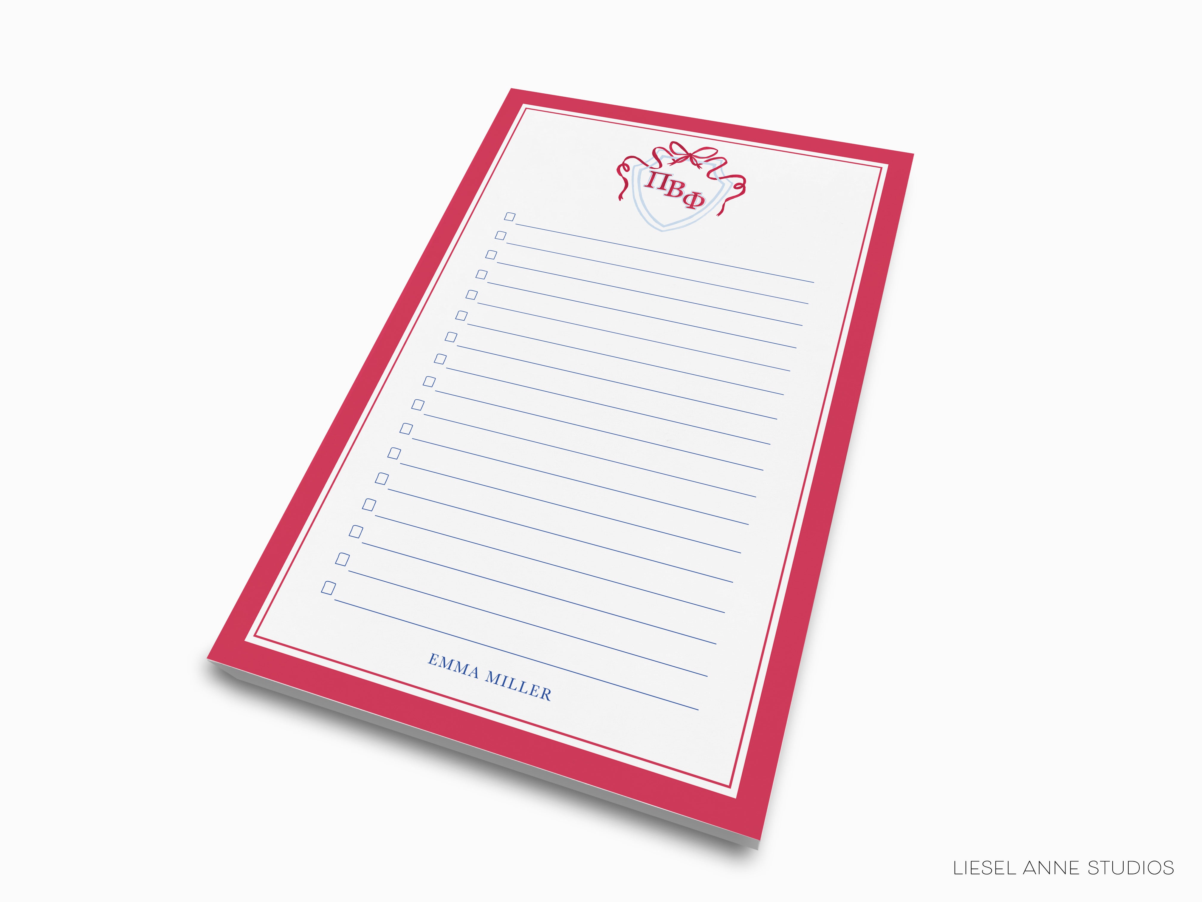 a red and white notepad with a red bow on it