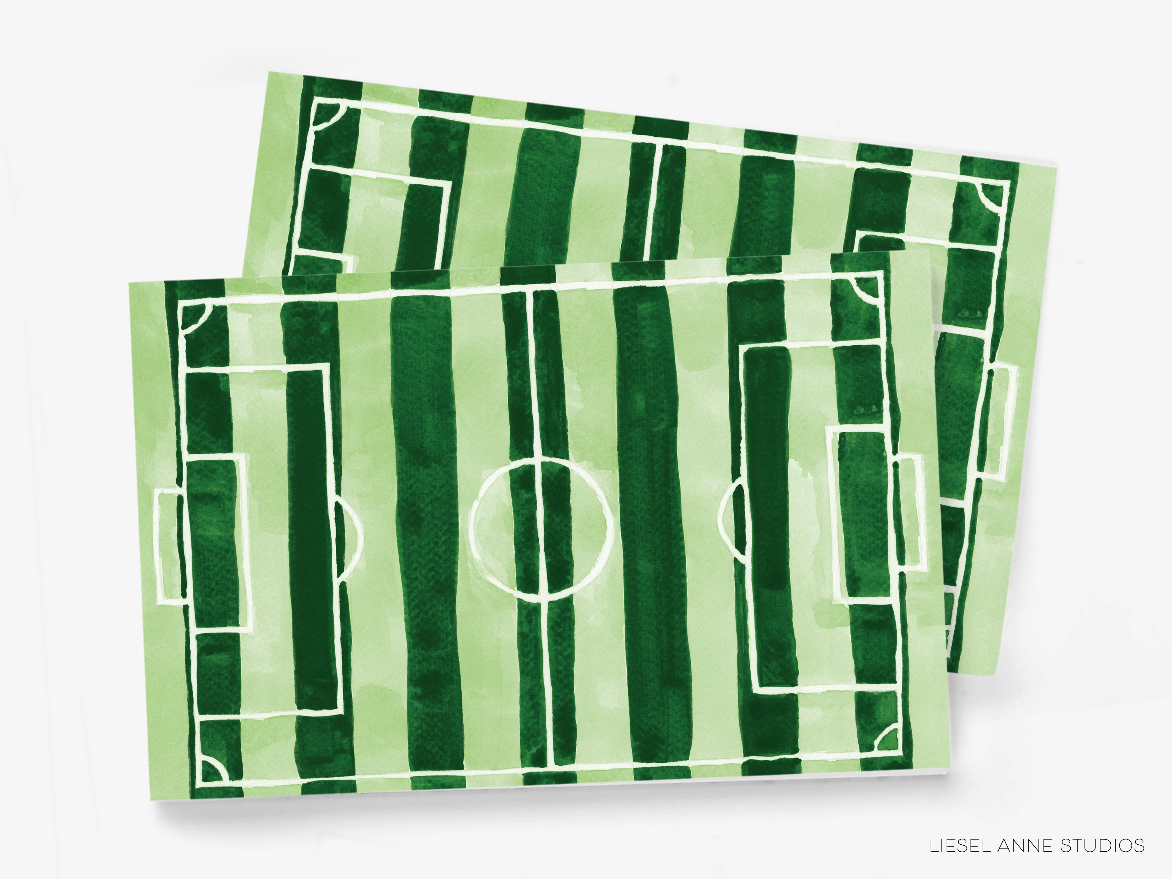 a green and white striped soccer field.