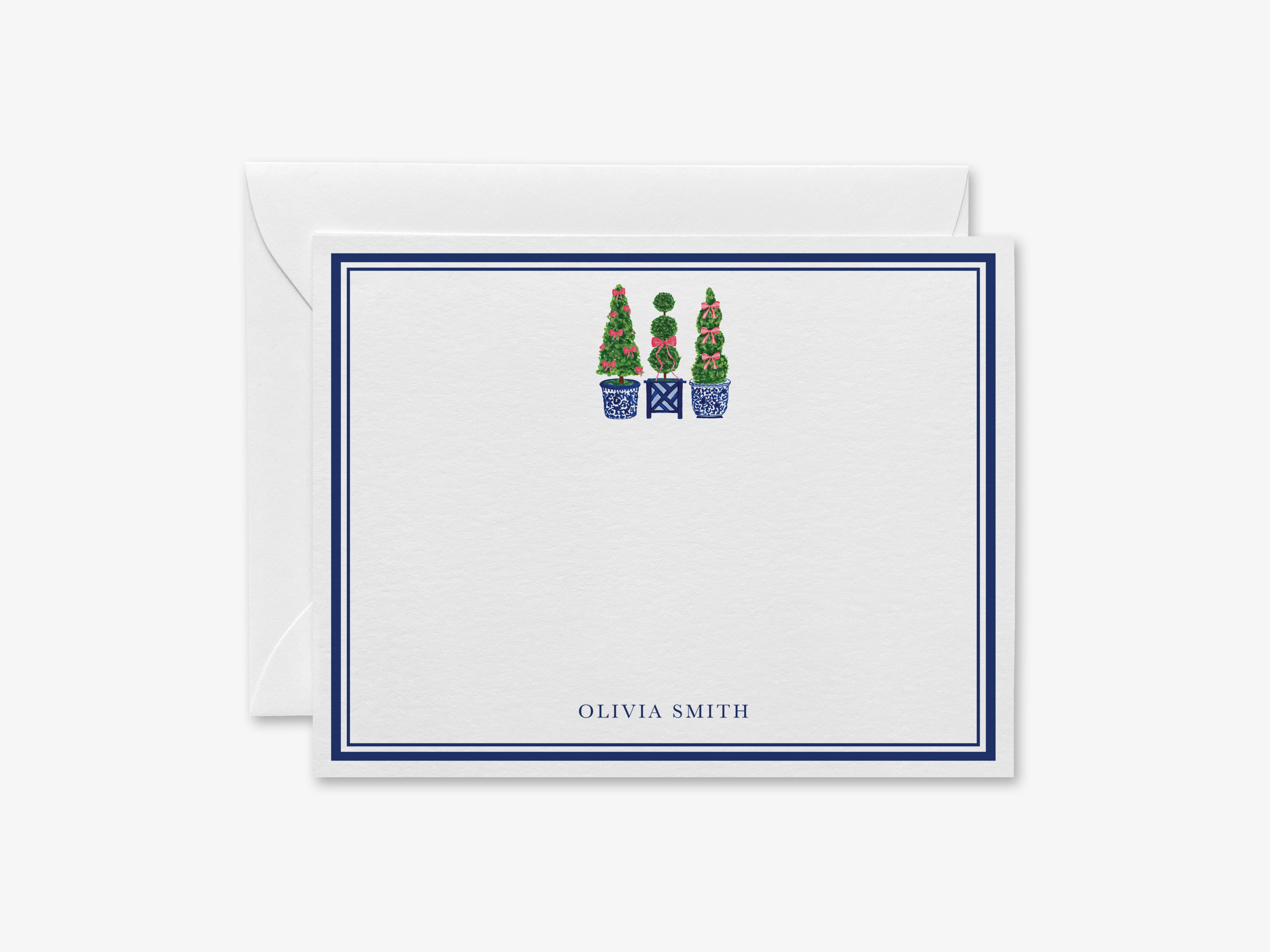 A white card with a blue border, featuring a decorative illustration of three topiary trees in blue pots.