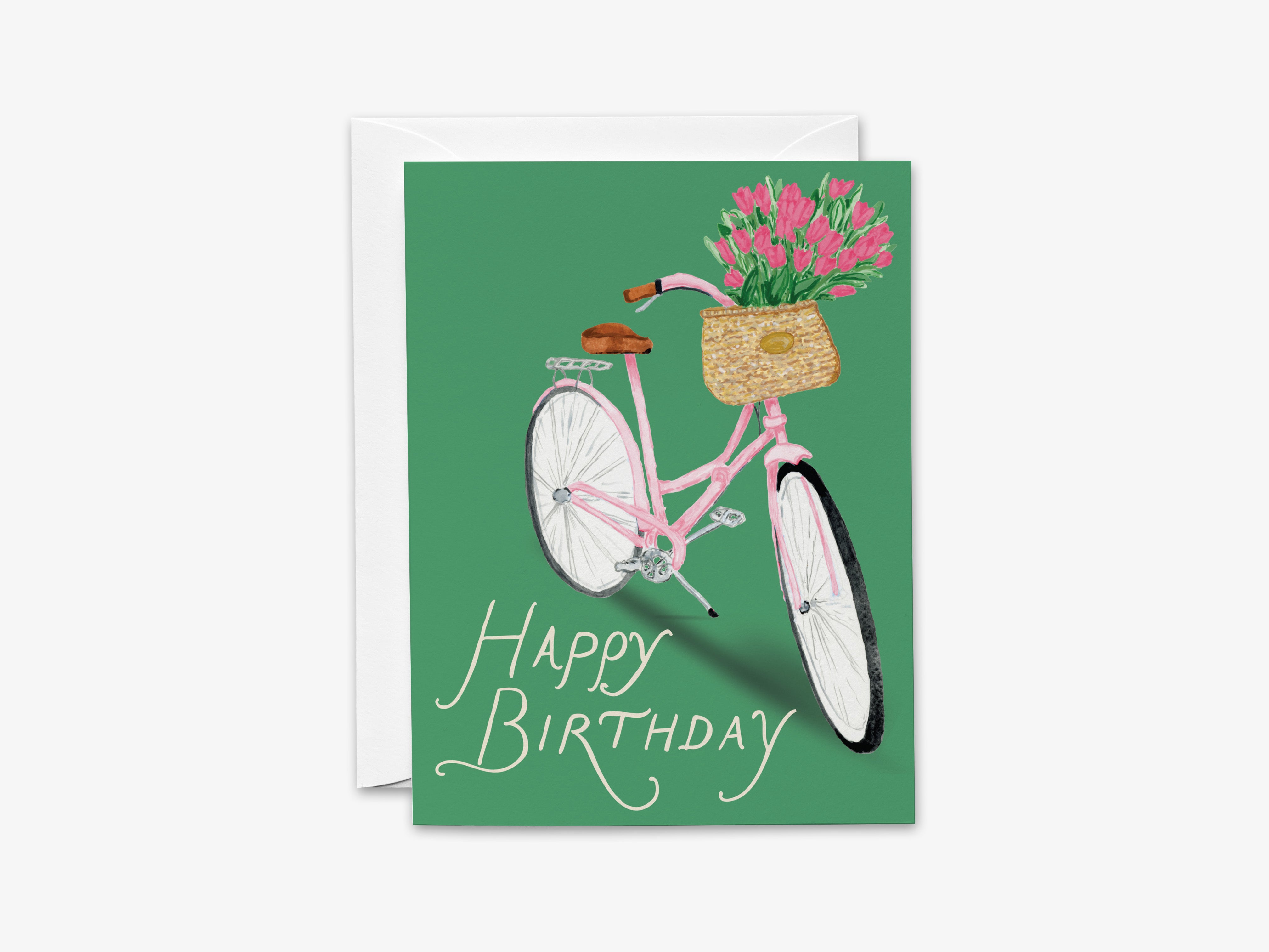 A birthday card with a pink bicycle and a basket of pink flowers on the handlebars.