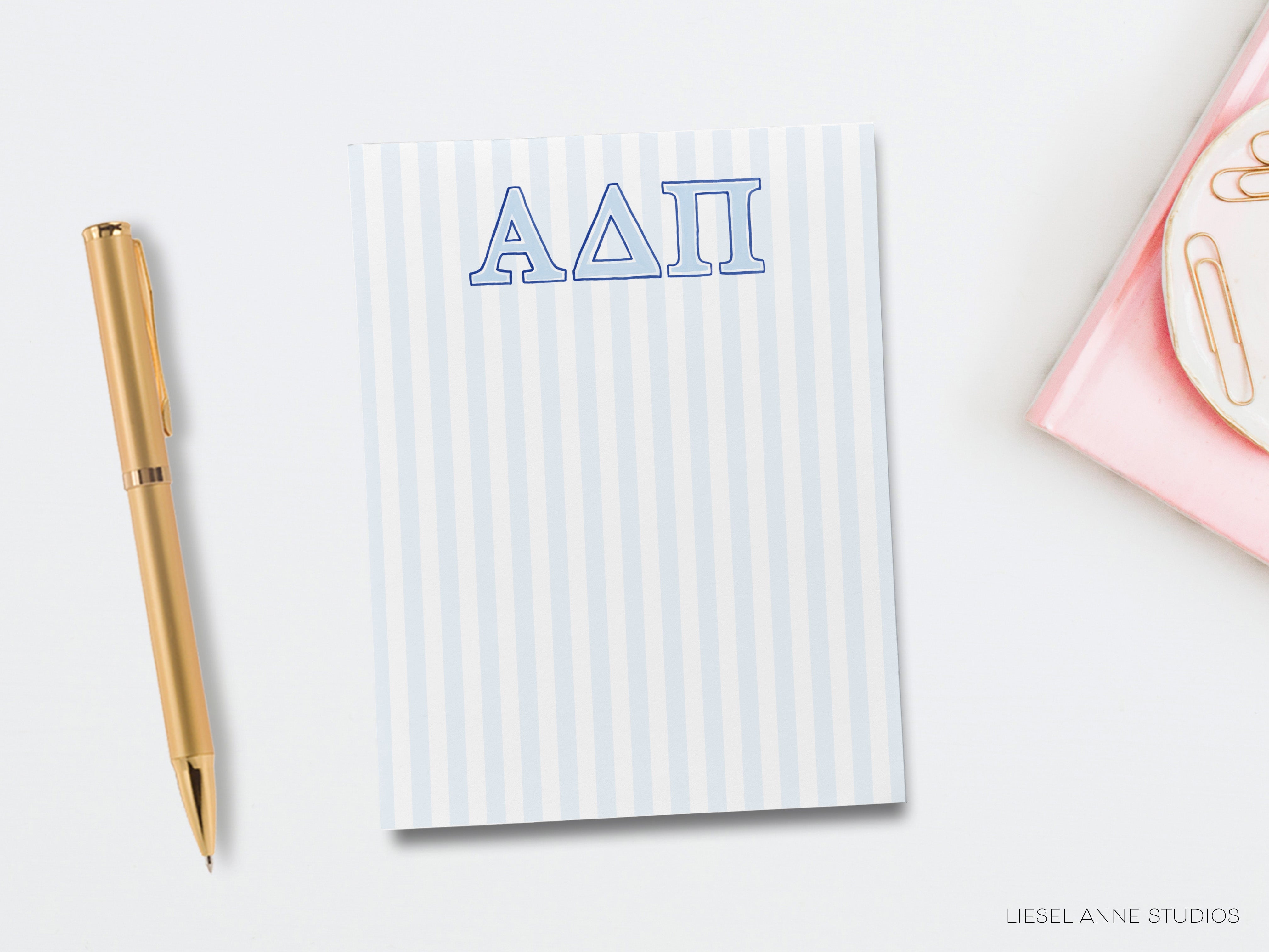 a notepad with the word iaa on it next to a pen