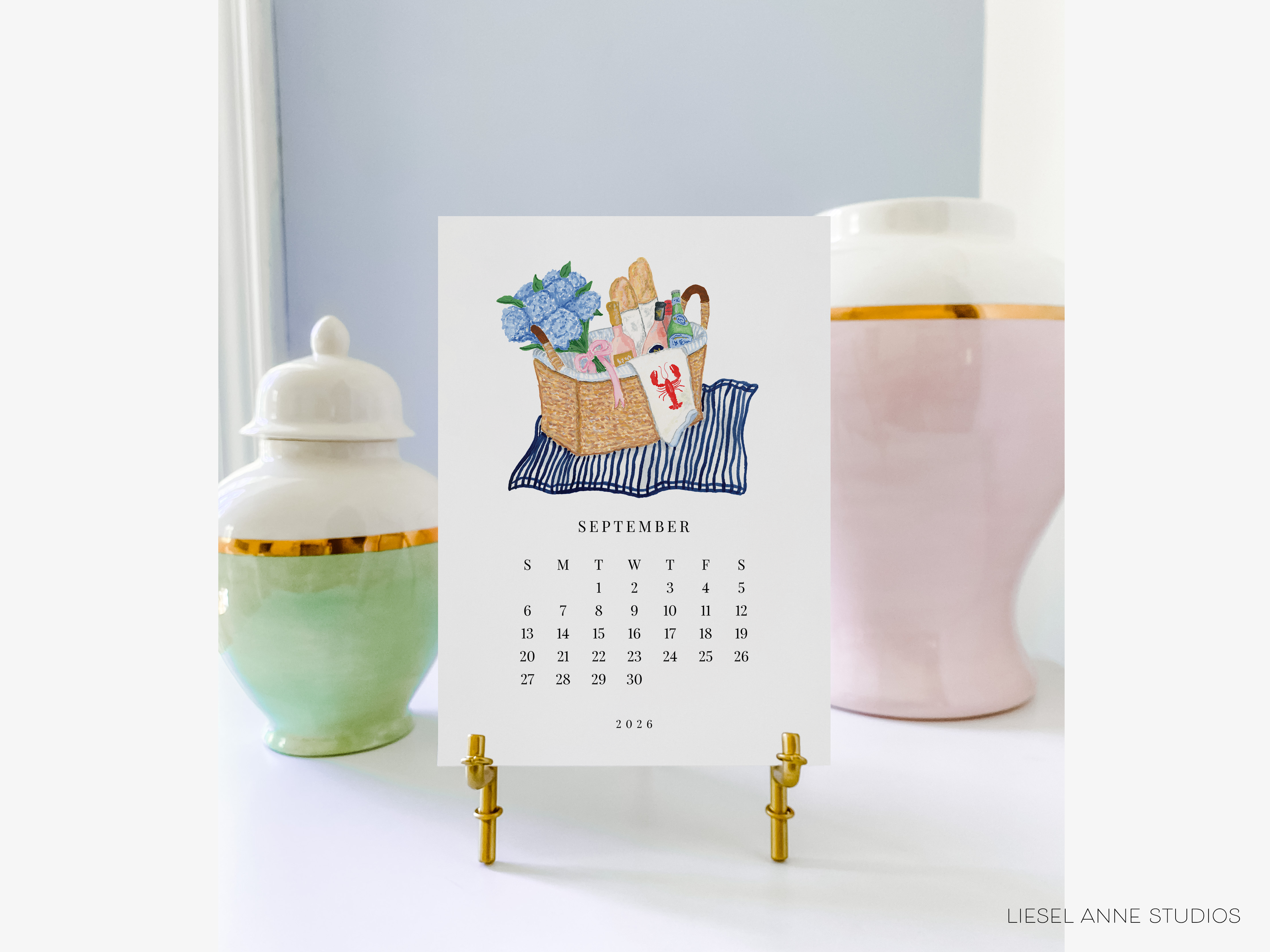 A September 2016 calendar with a blue and white striped background and a white and gold vase on the left side.