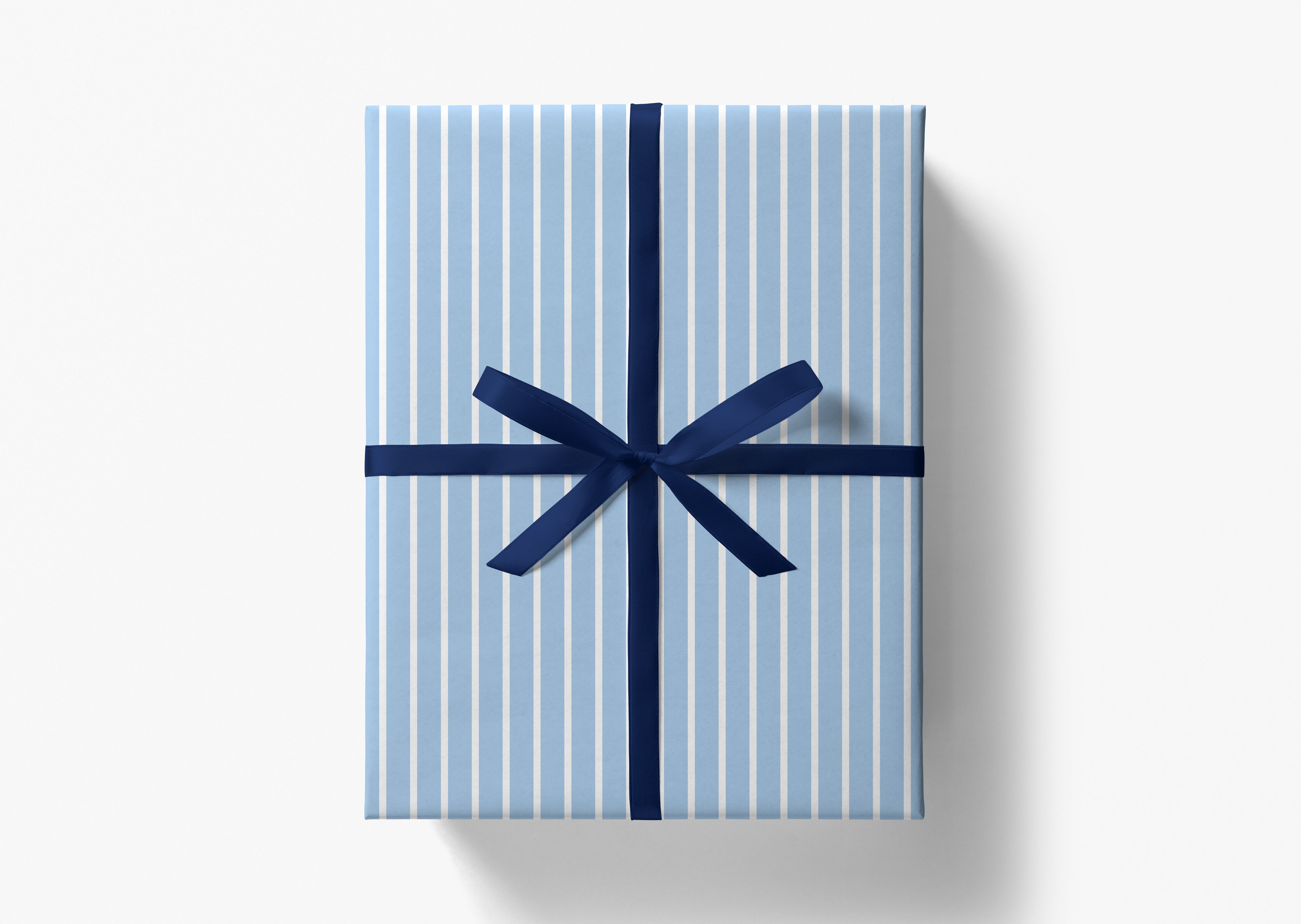 A gift box wrapped in blue and white striped paper with a blue ribbon tied in a bow.