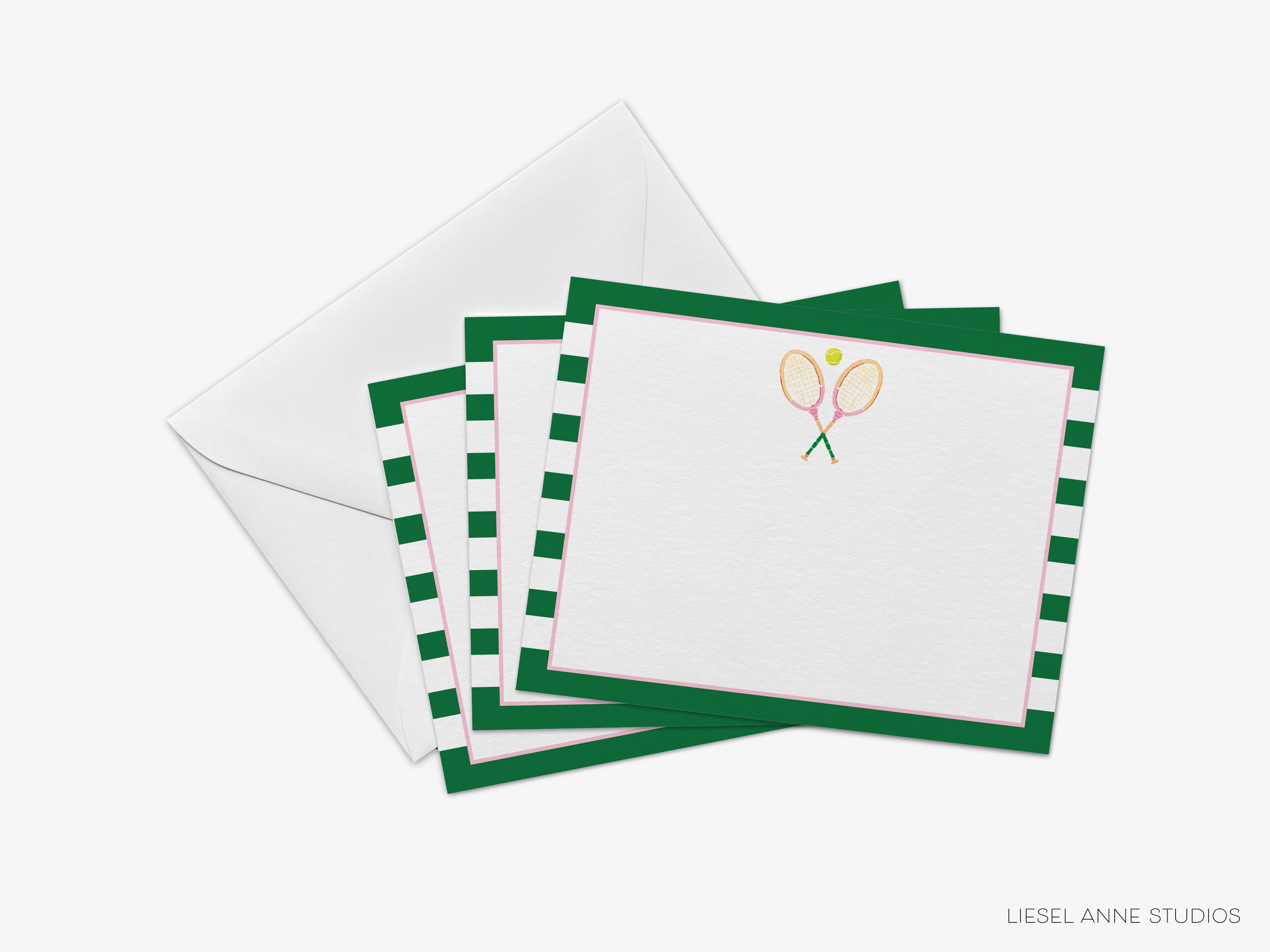 A set of green and white tennis-themed postcards with tennis rackets and a tennis ball on the front, placed on top of an envelope.