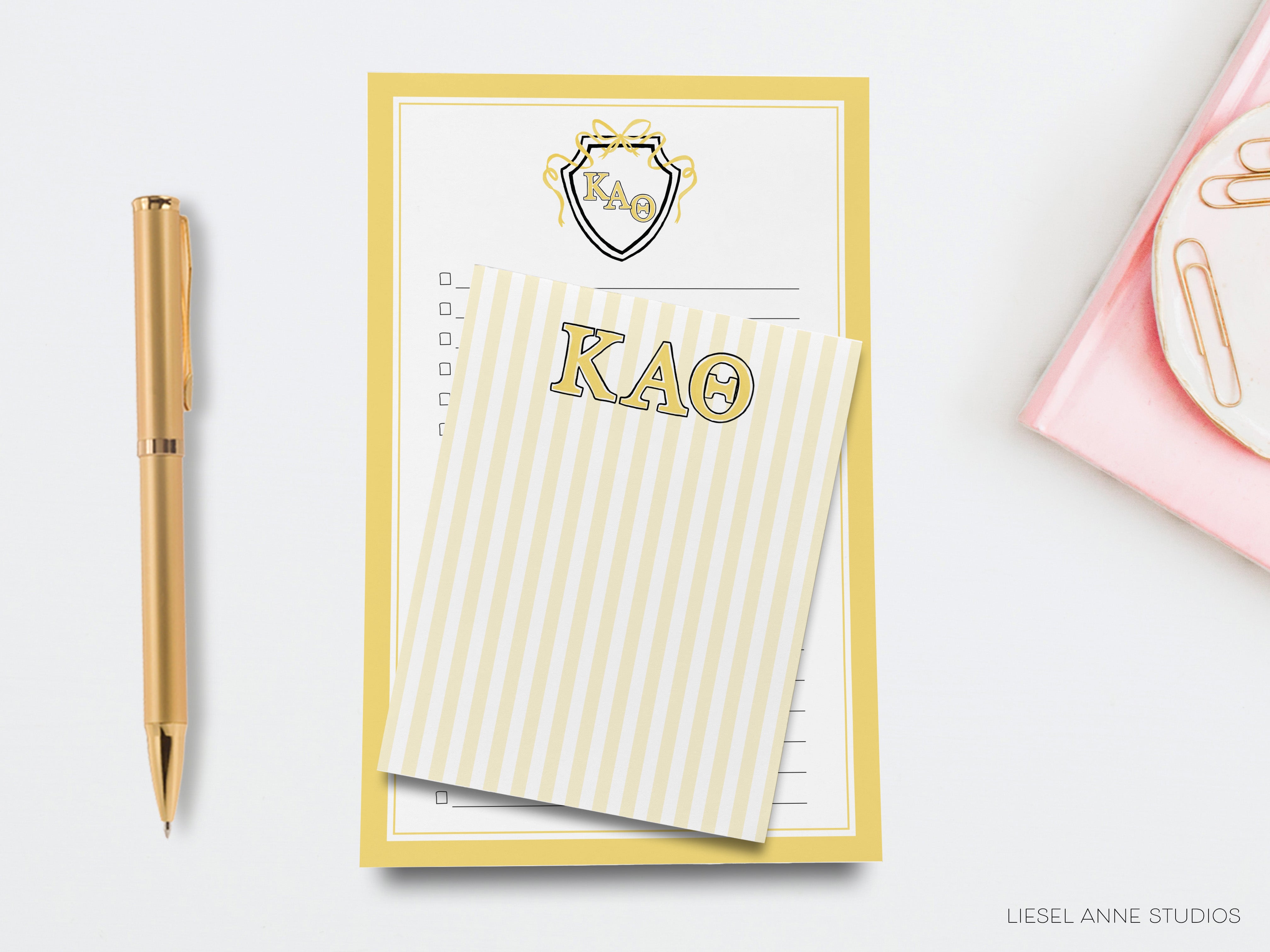 a notepad with a kao on it next to a pen