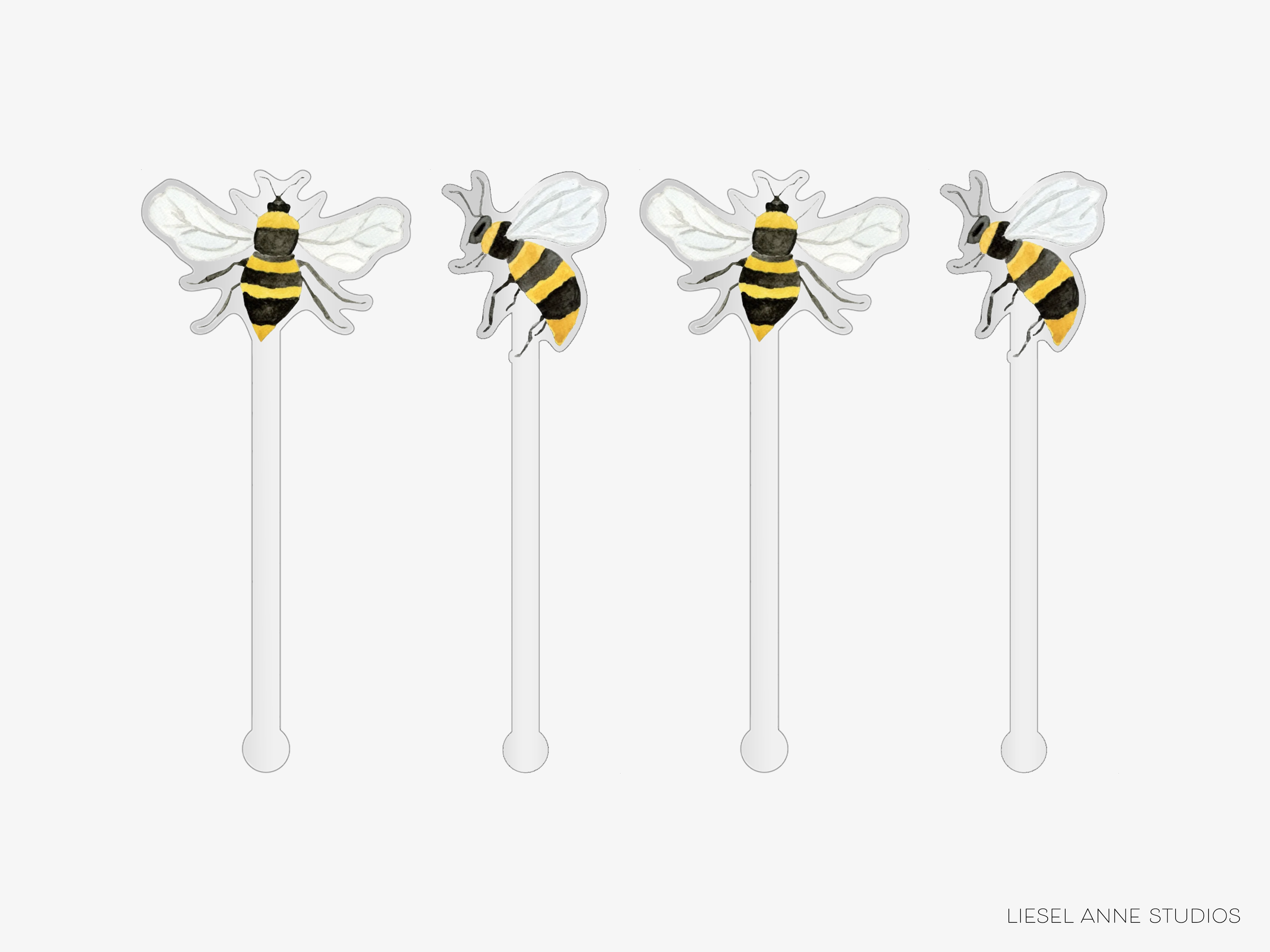 four straws with bee-like designs on them.