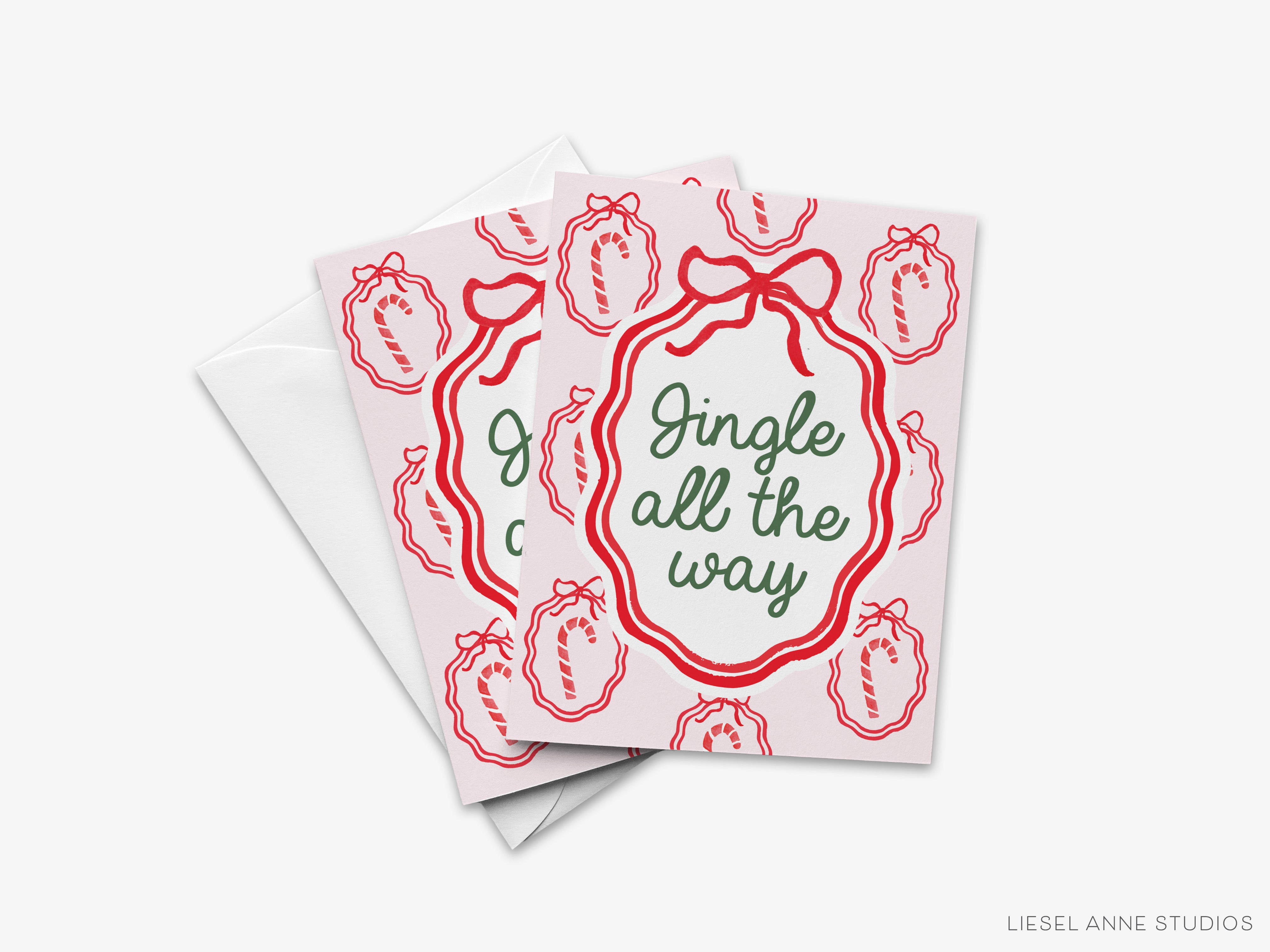A set of three greeting cards with a festive design featuring red and green elements, including candy canes and the text "Jingle all the way".