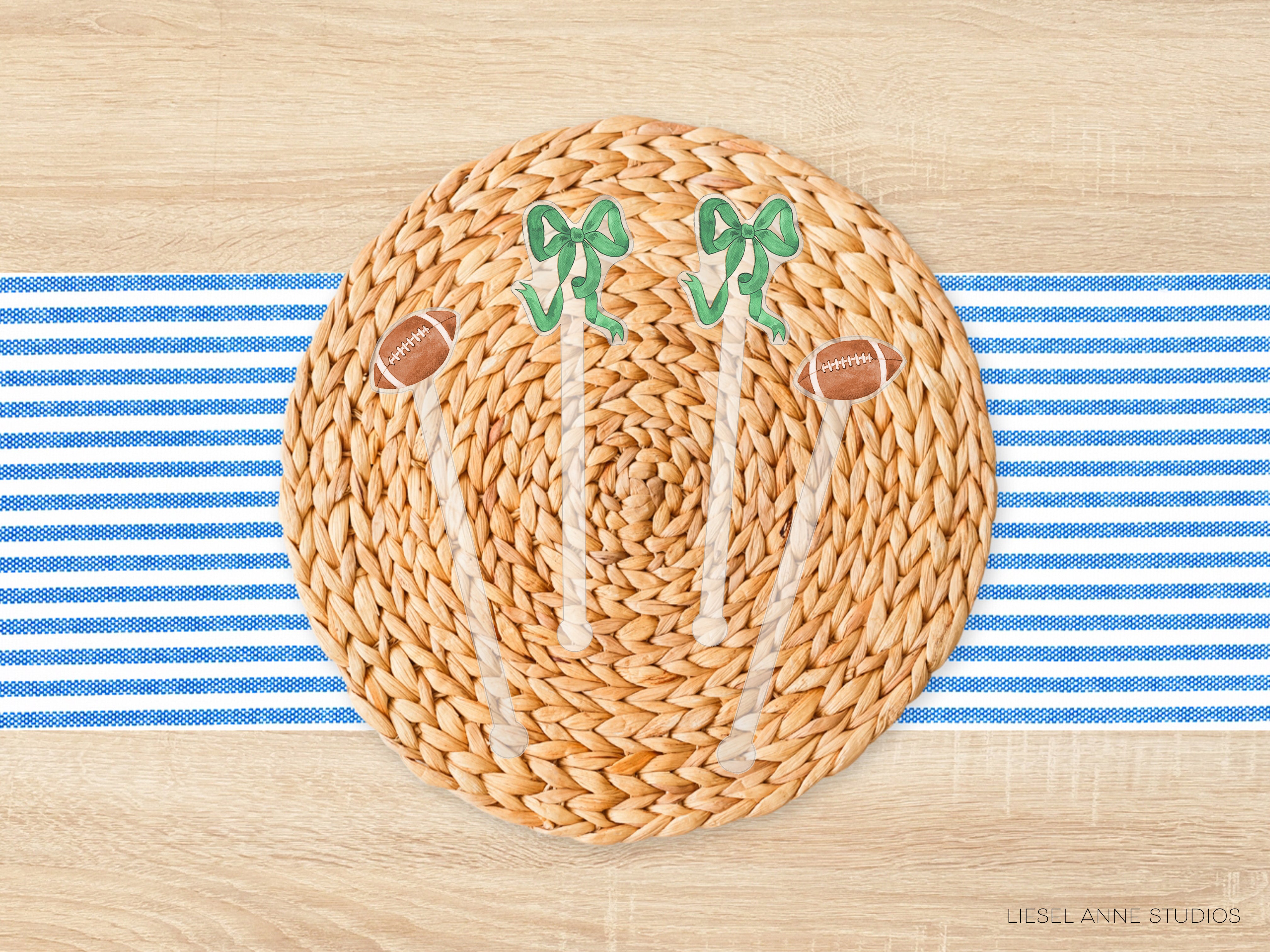 A woven placemat with a football design and two green bows, placed on a blue and white striped tablecloth.