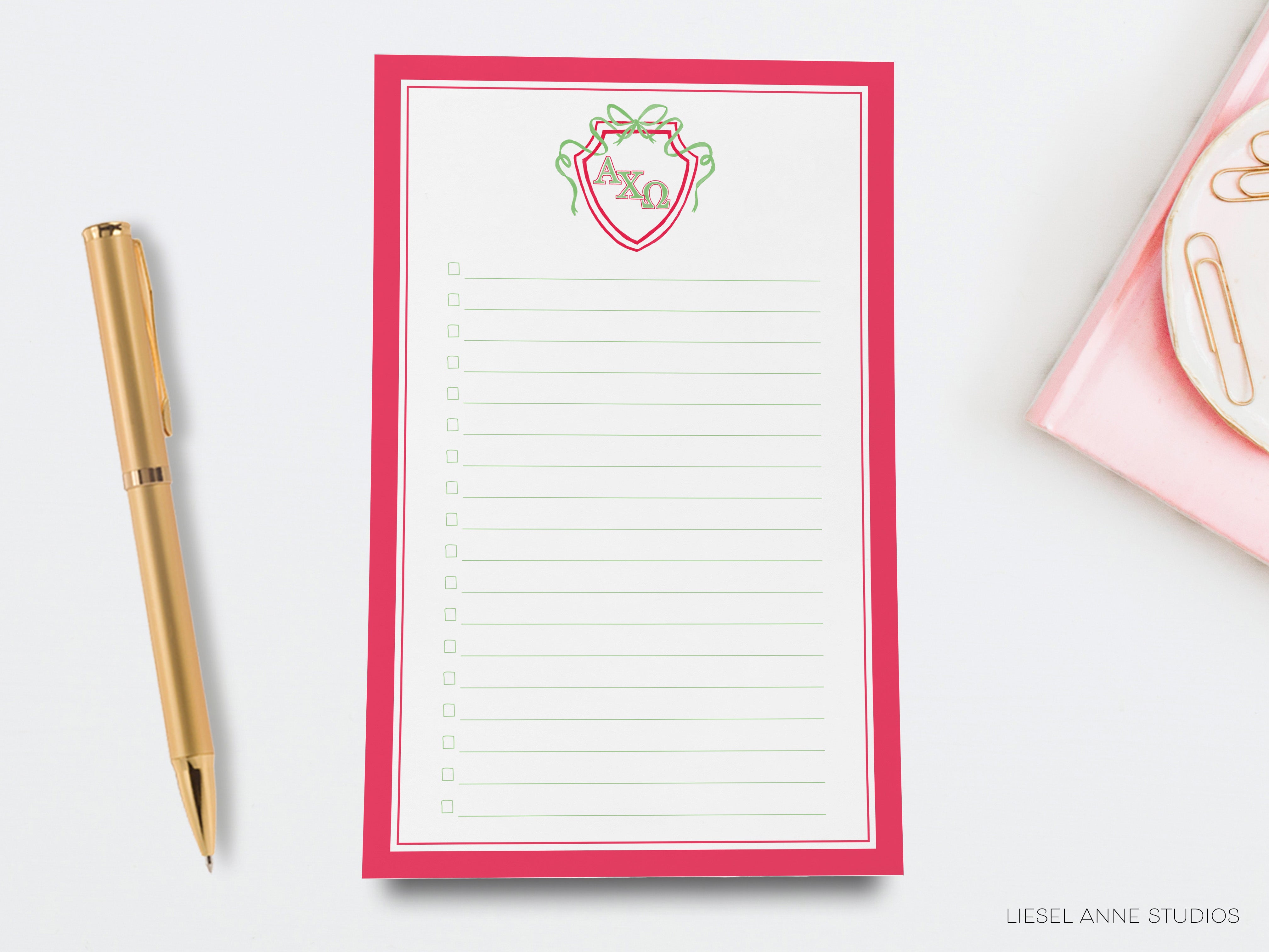 a notepad with a notepad attached to it next to a pen