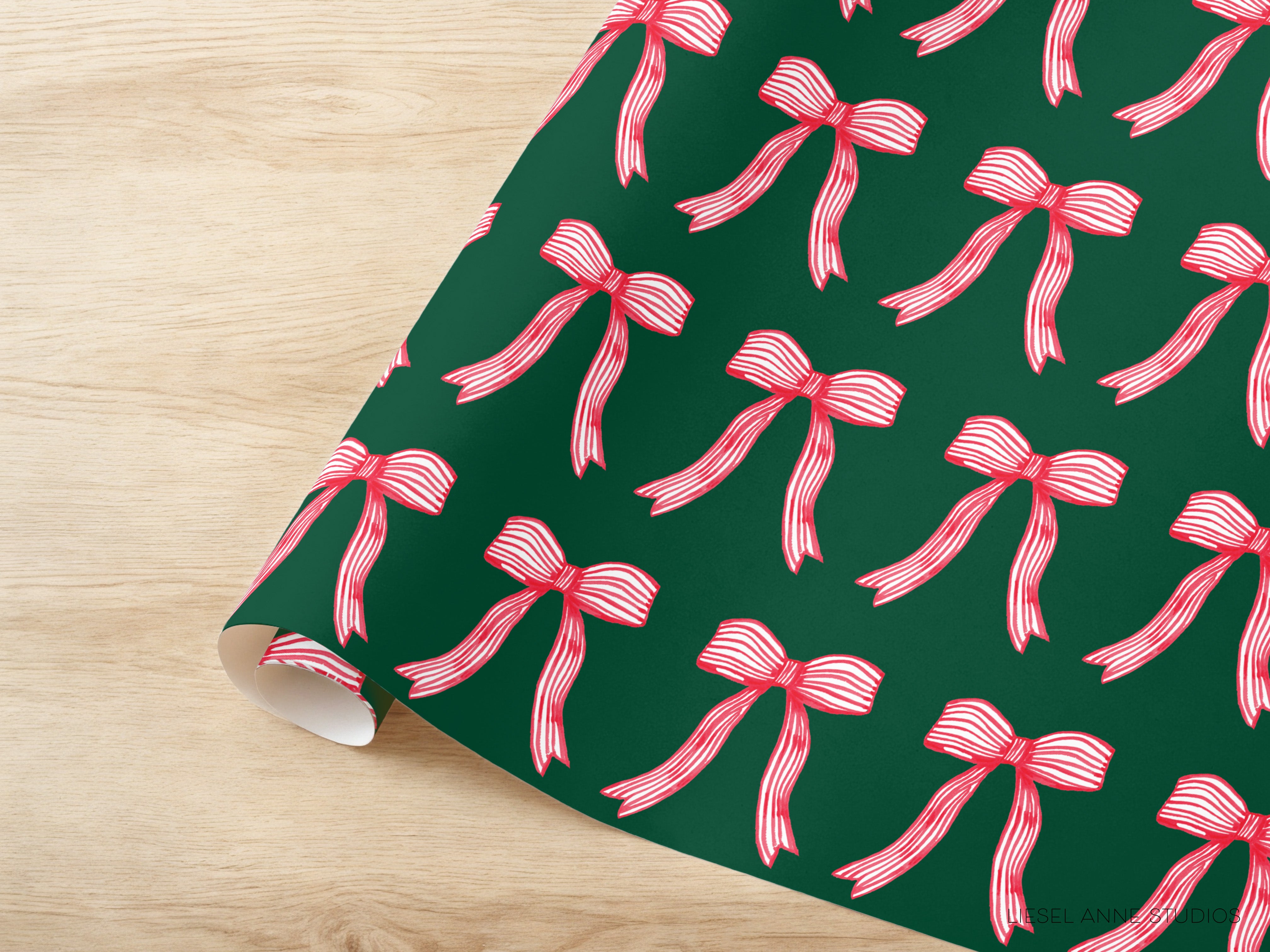 a pattern of red and white bows on a dark green background.