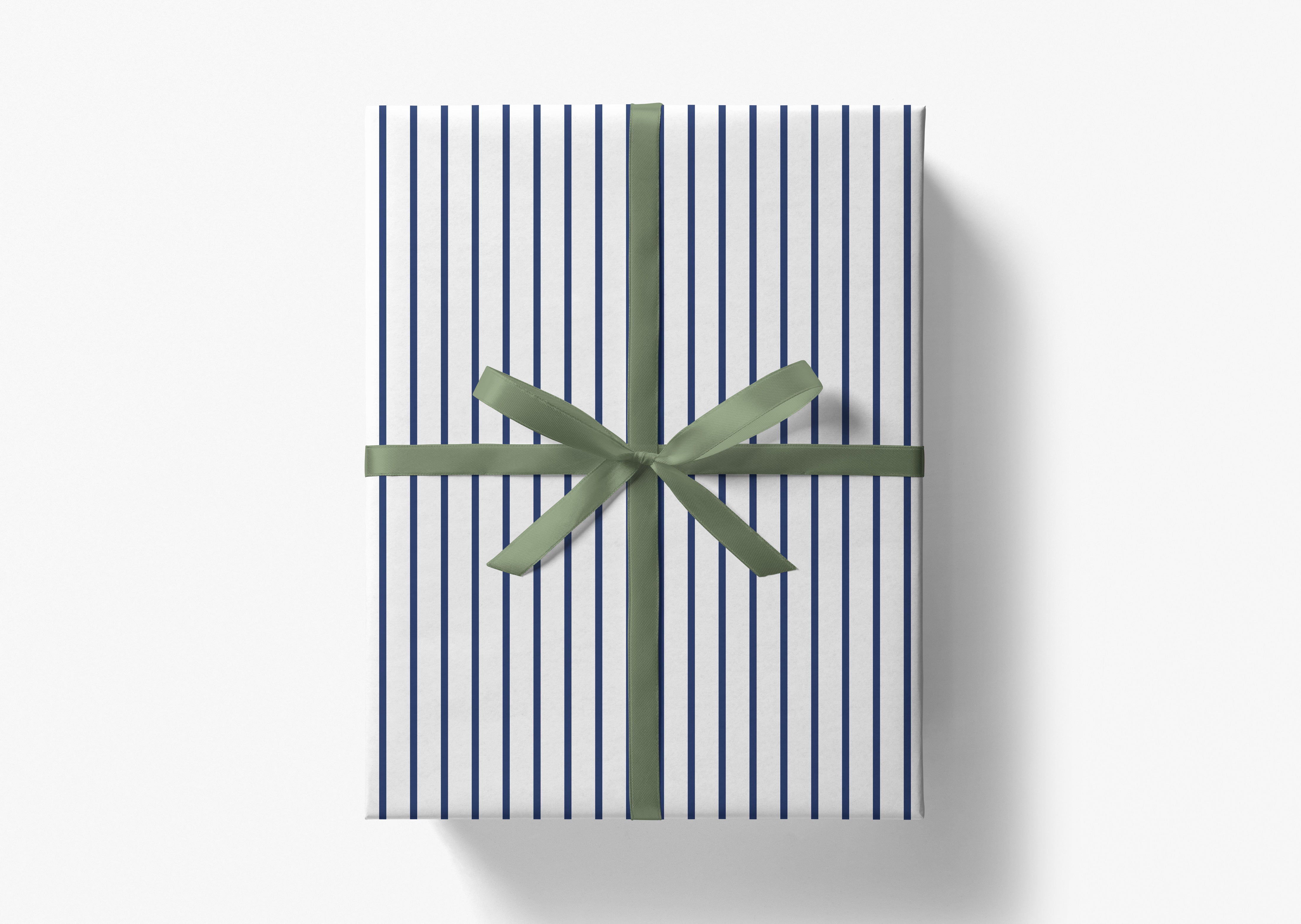 A gift box wrapped in a striped paper with a green ribbon tied in a bow.