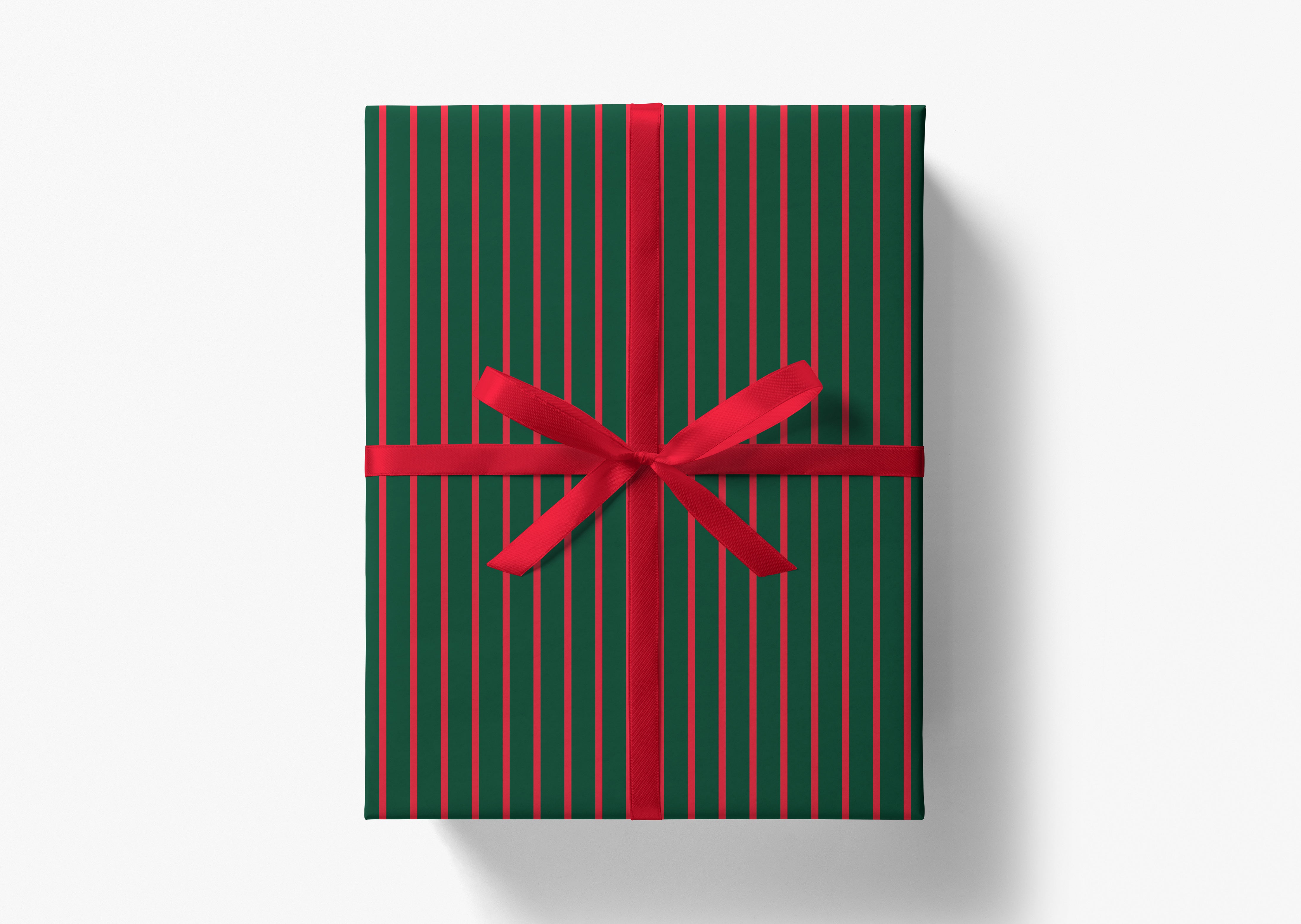 A green gift box with red stripes and a red ribbon tied around it.
