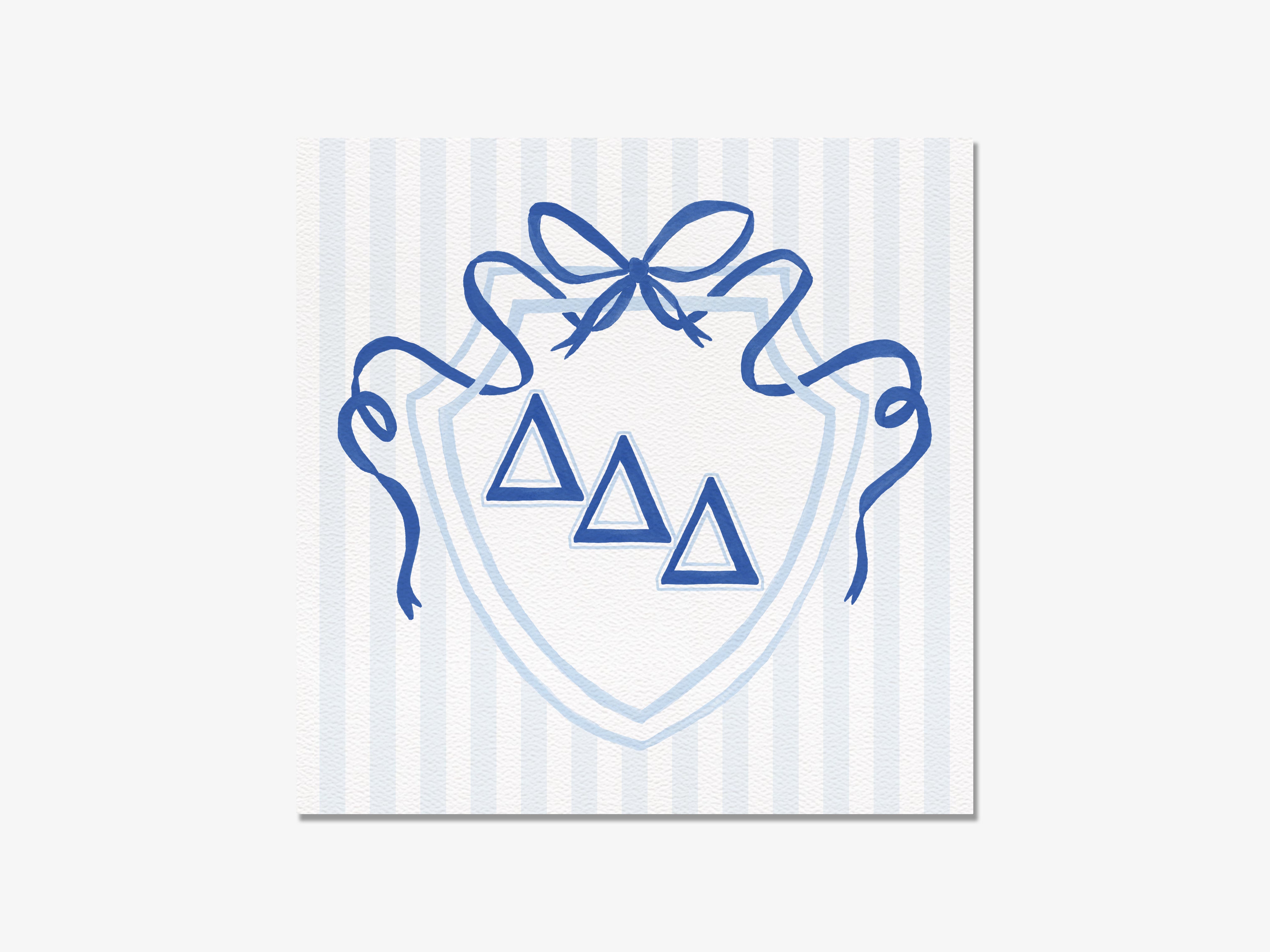 a shield with three blue triangles and a blue ribbon bow.