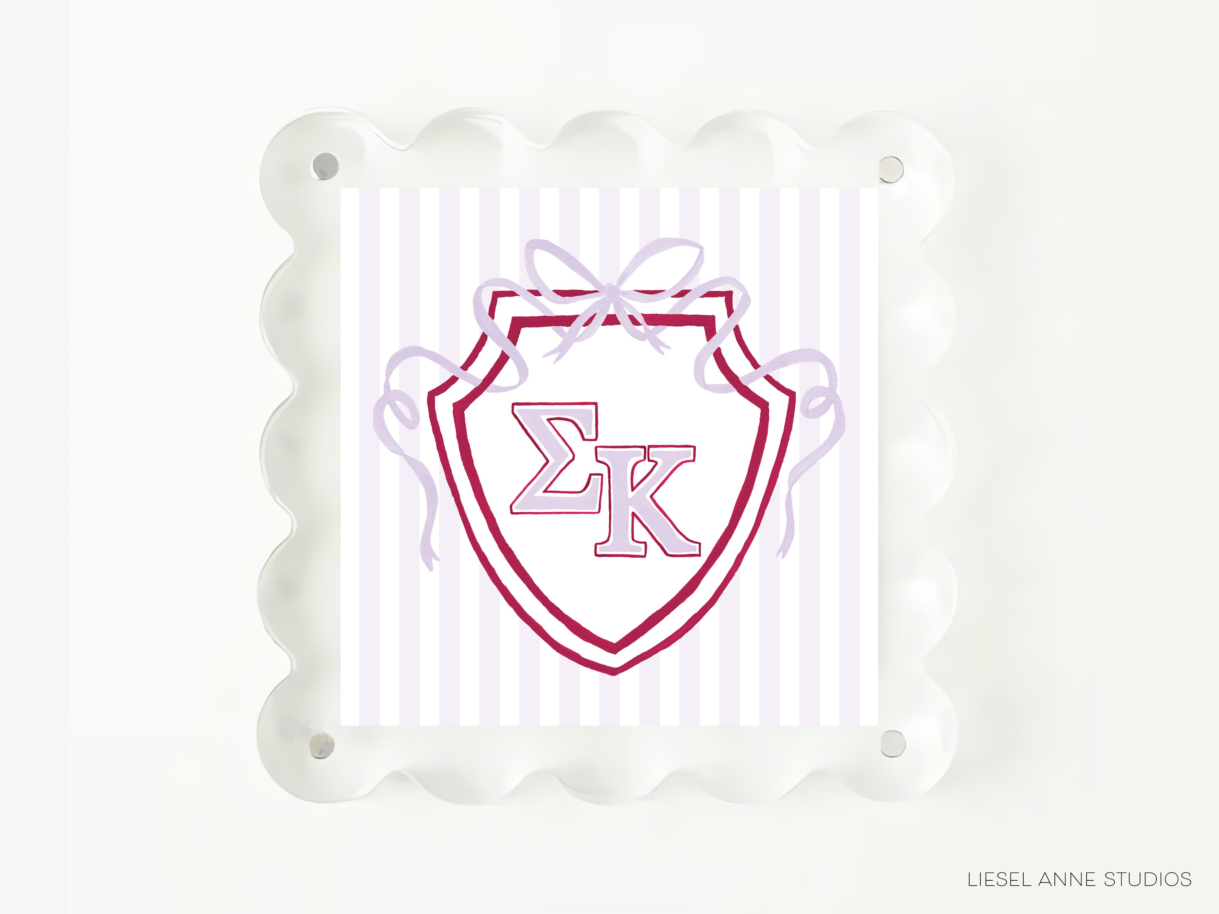 a shield-shaped emblem with the letters 'EK' prominently displayed in the center.