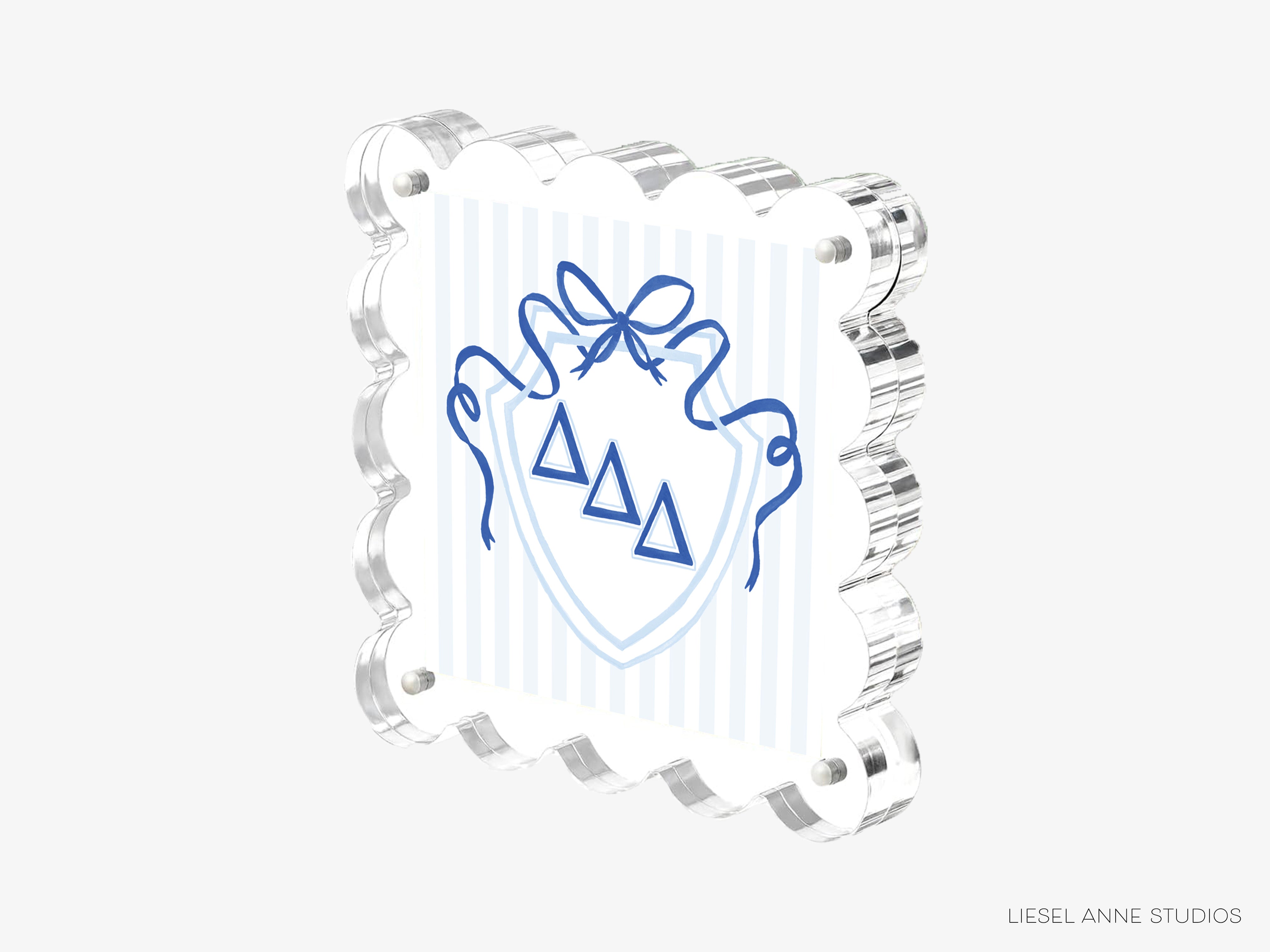 A 3D rendering of a shield-shaped object with a blue ribbon and three triangular symbols on it, set against a white background.