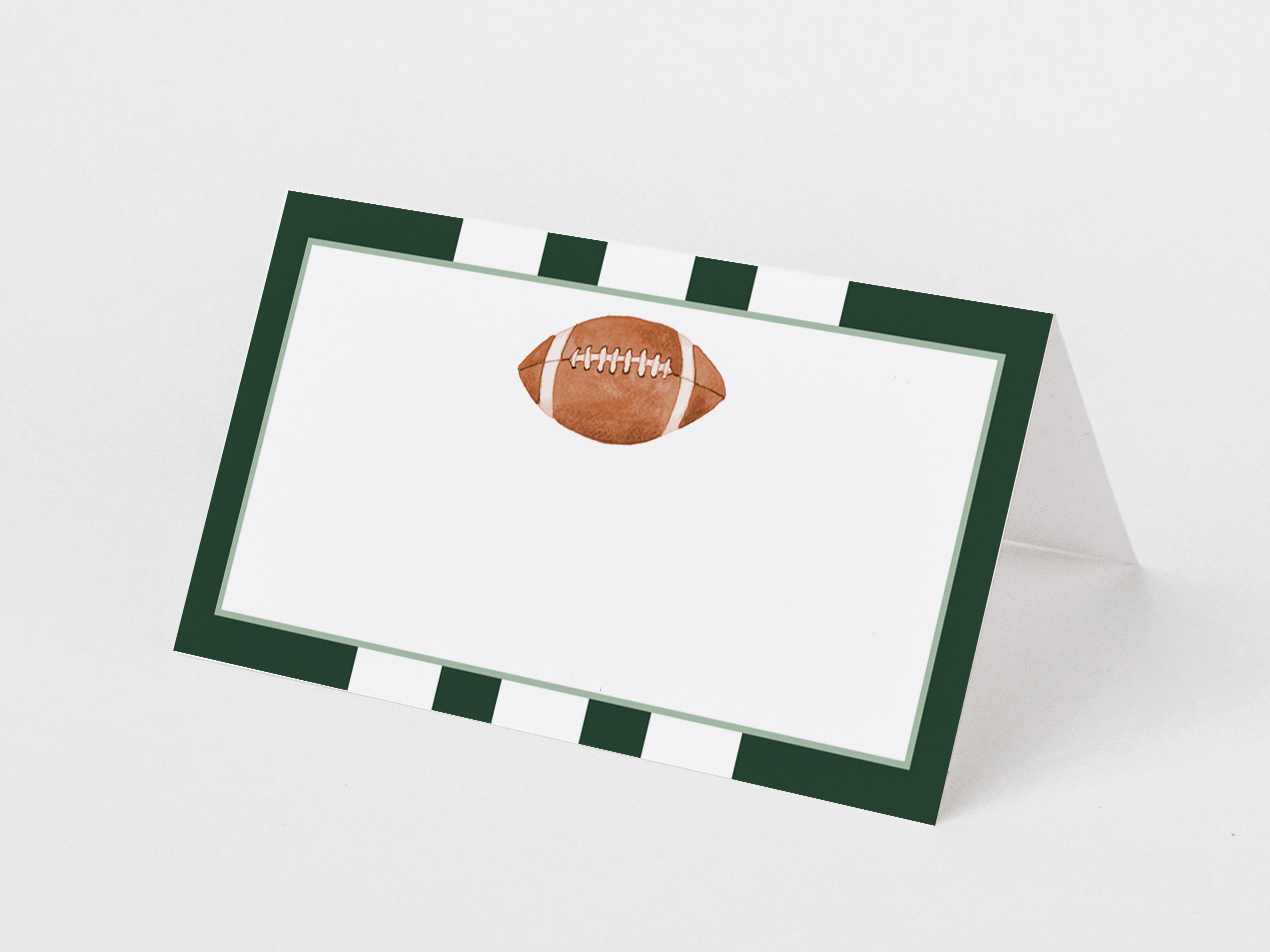 A white card with a green border and a football graphic printed on it.