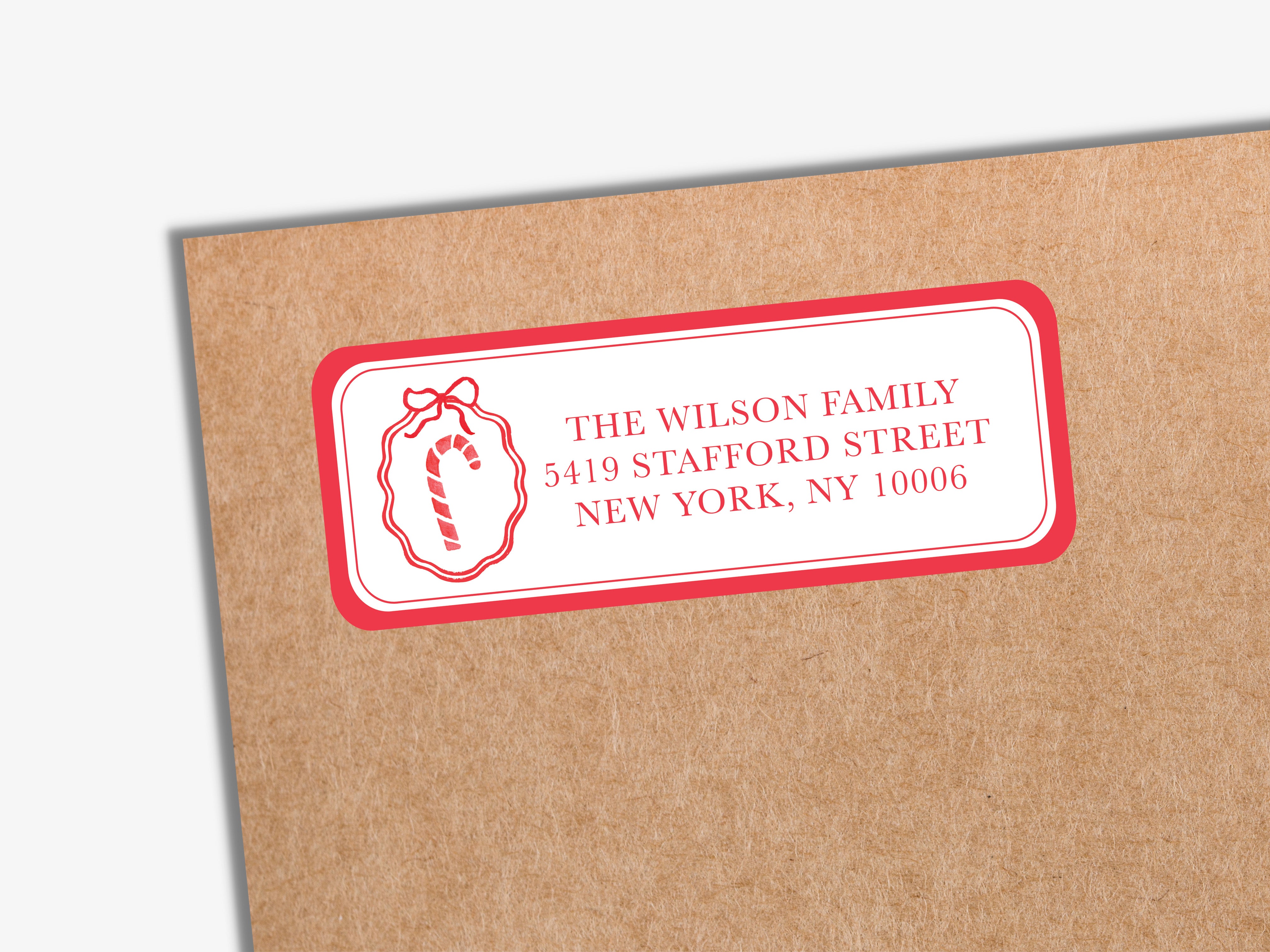 A red and white envelope label for "The Wilson Family" with the address "5419 Stafford Street, New York, NY 10006".