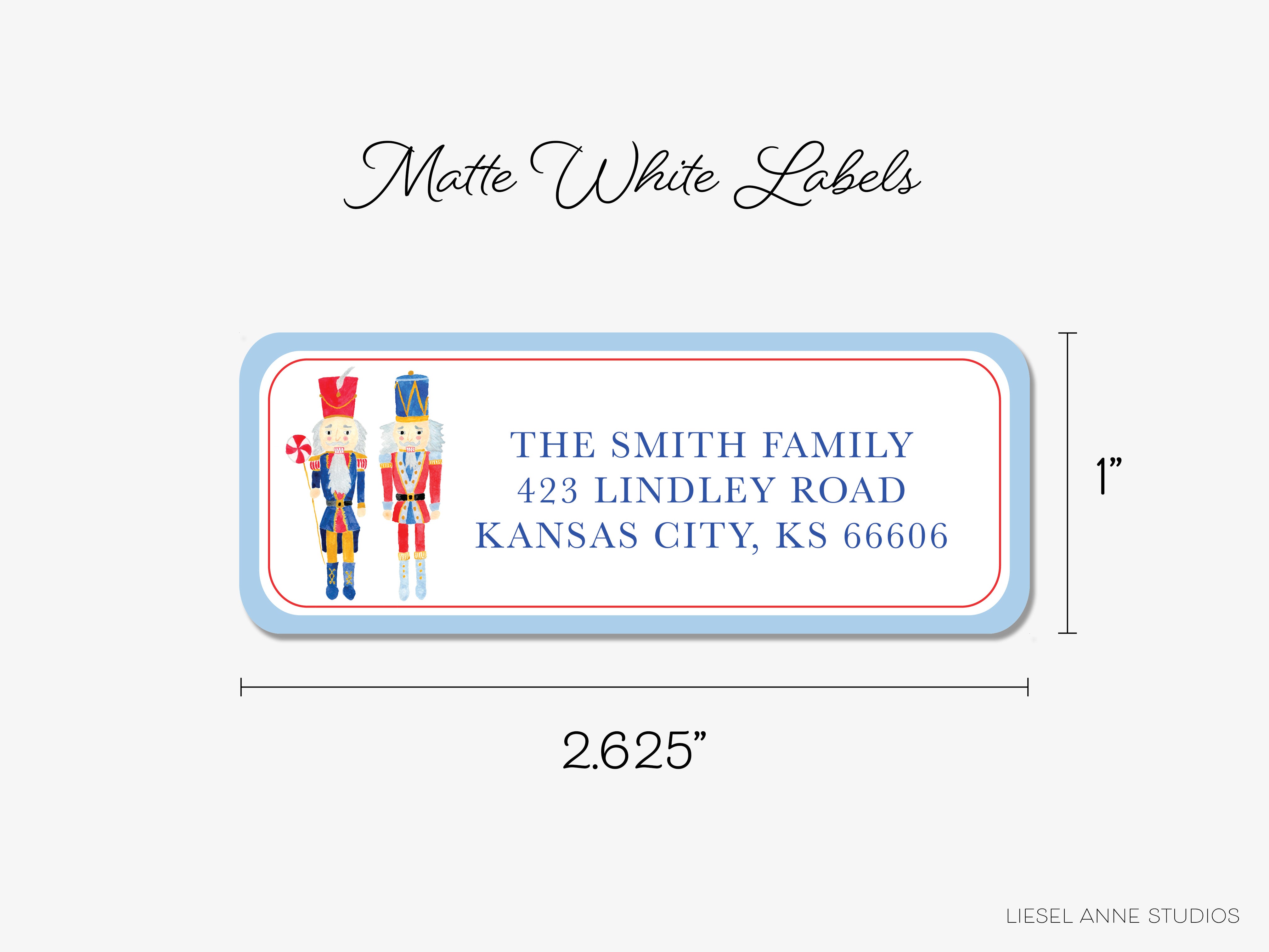 The image is a label for a mailbox, featuring a nutcracker and an acorn design. The label is white and measures 2.25 inches in length.