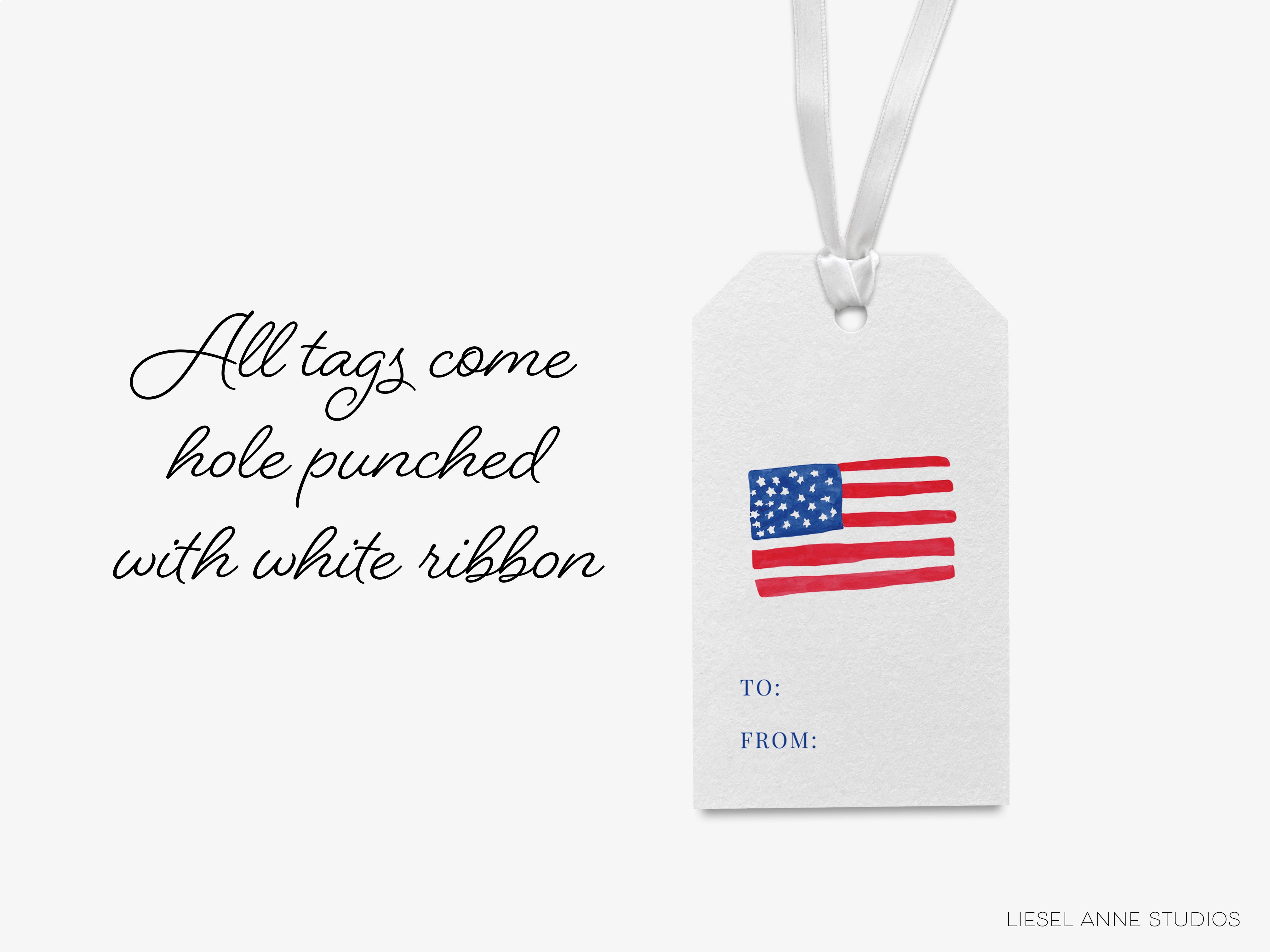 a white tag with a hole punch and a ribbon, featuring an American flag design.
