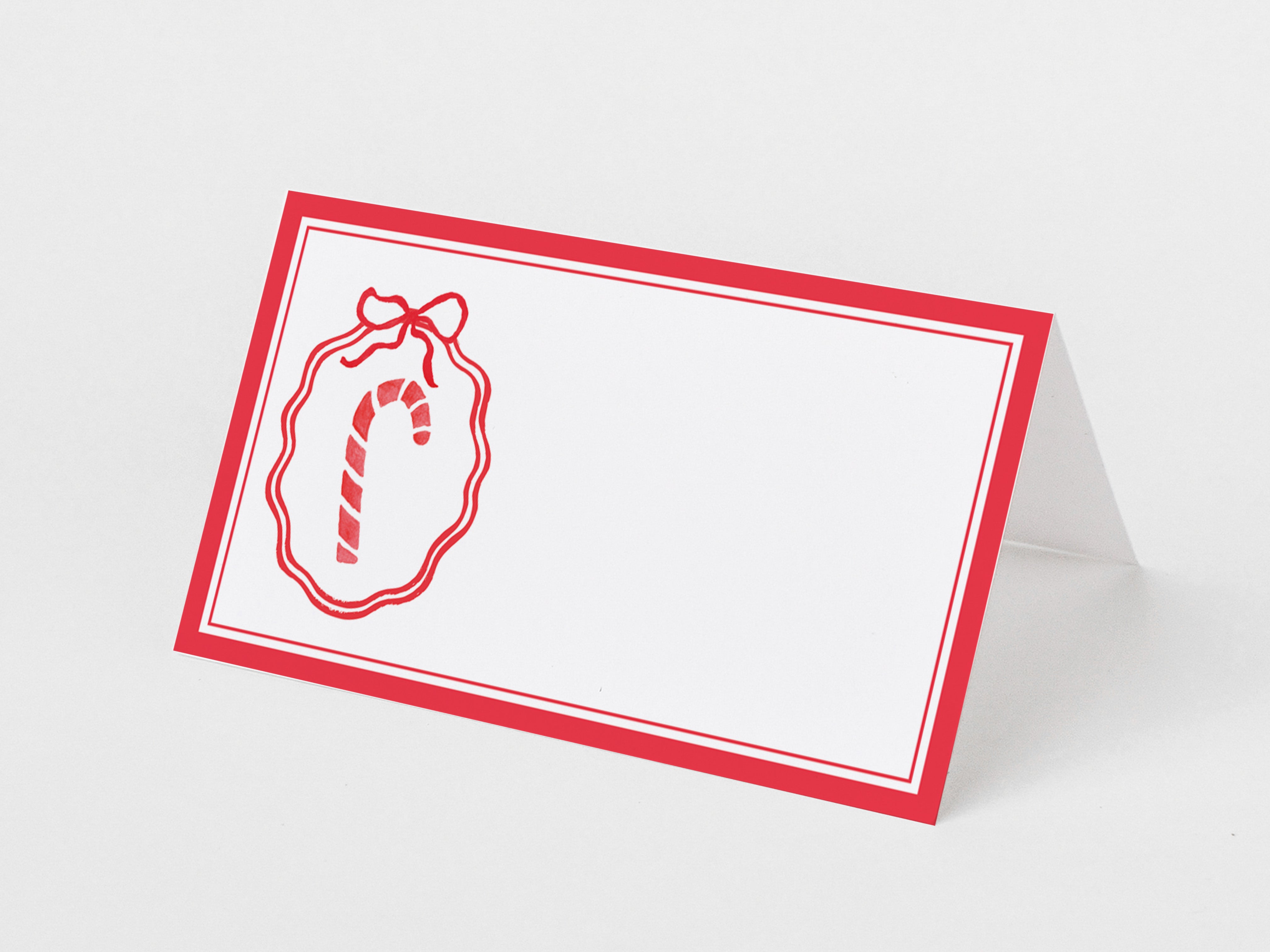 a red and white label with a candy cane design on it.