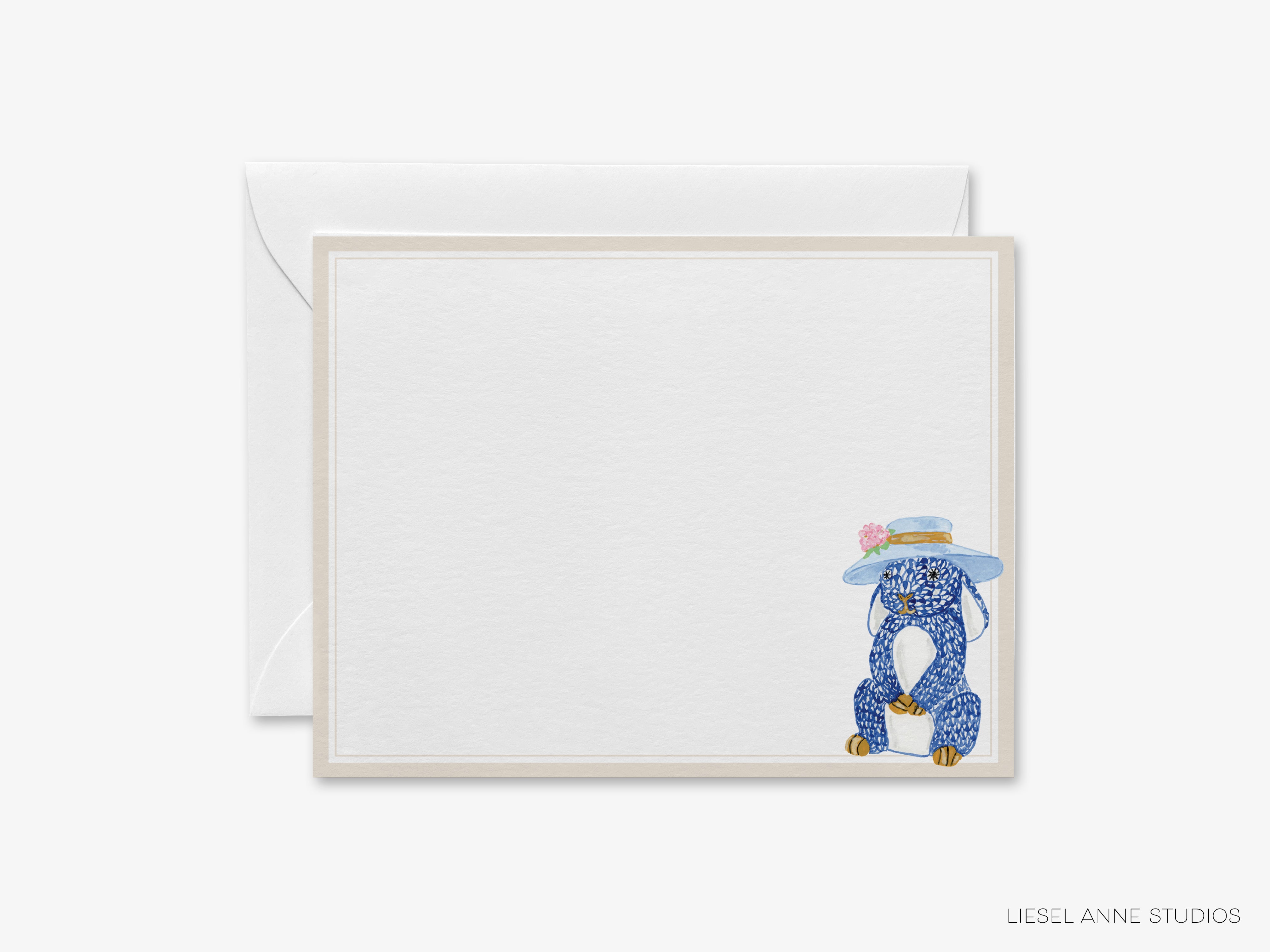 A blank card with a blue and white illustration of a dog wearing a hat, sitting on a chair.
