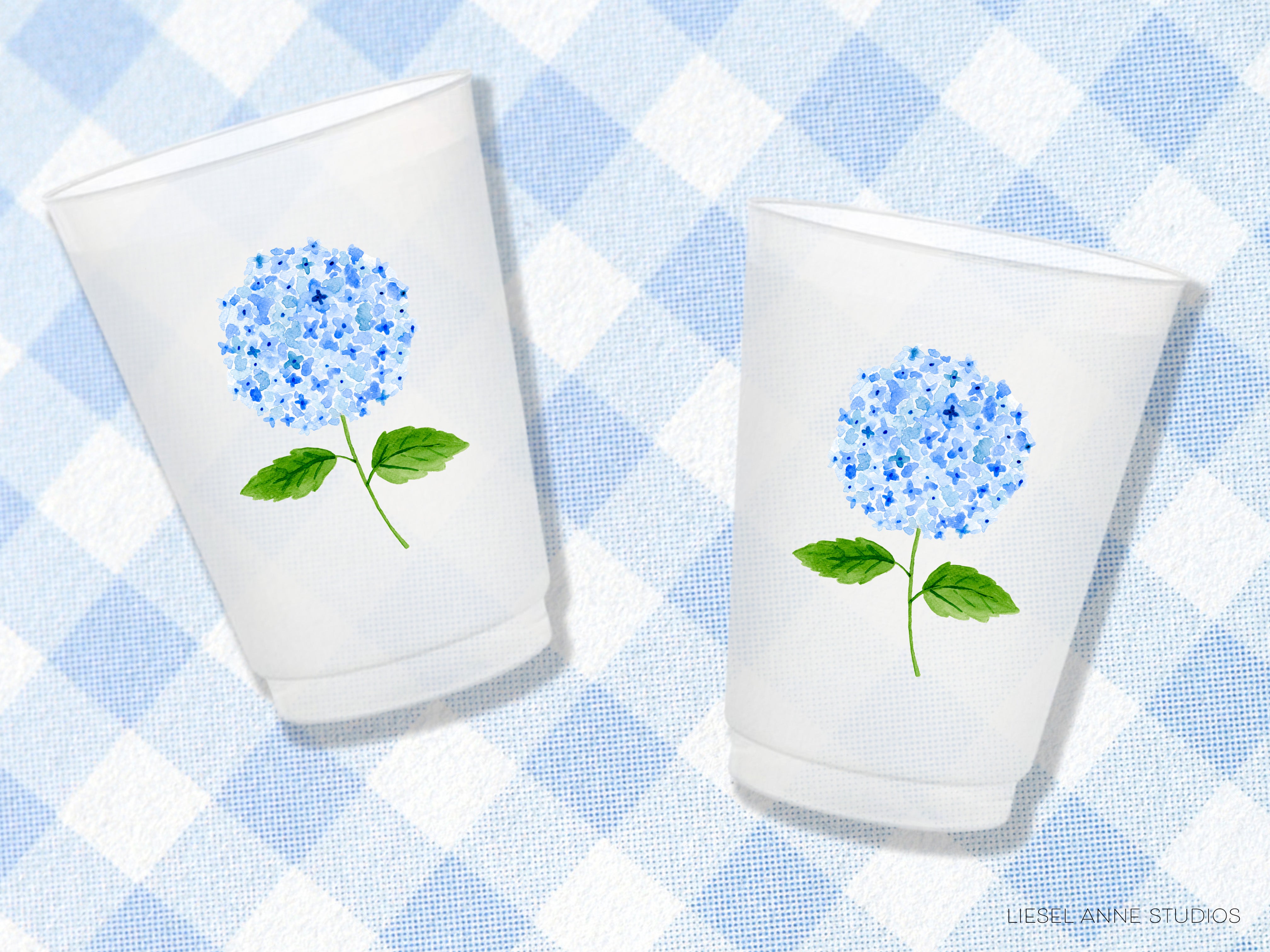 two cups with blue flowers painted on them