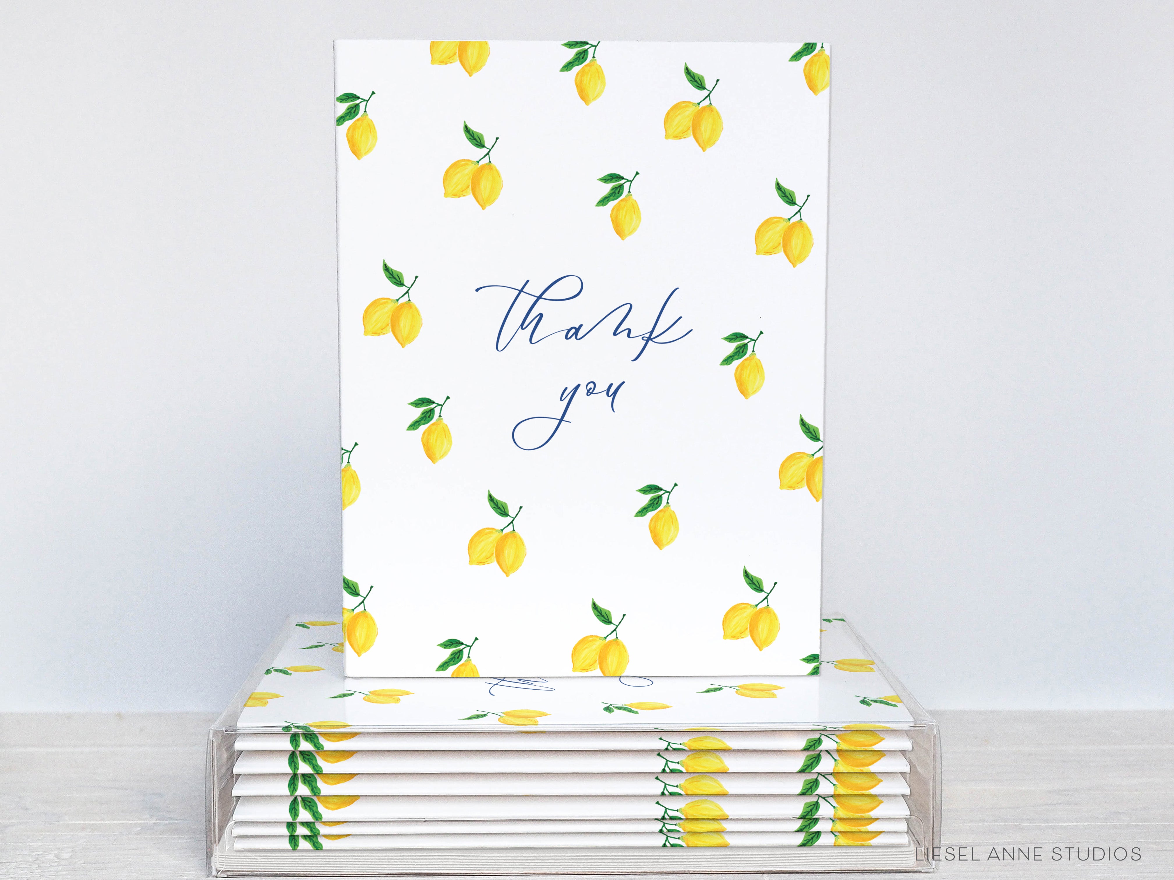 a stack of greeting cards with lemons on them